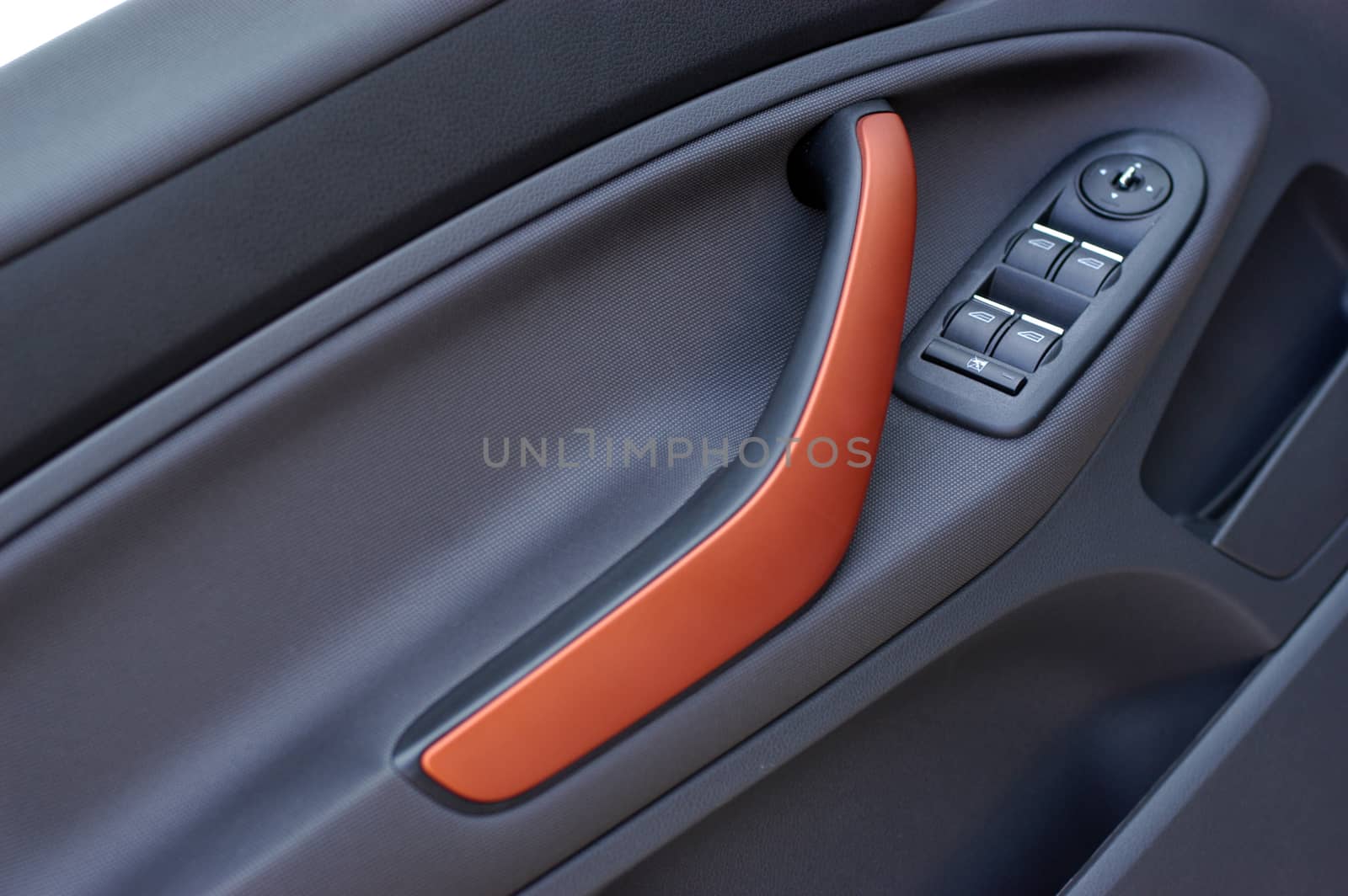the inside of the car, handle and button