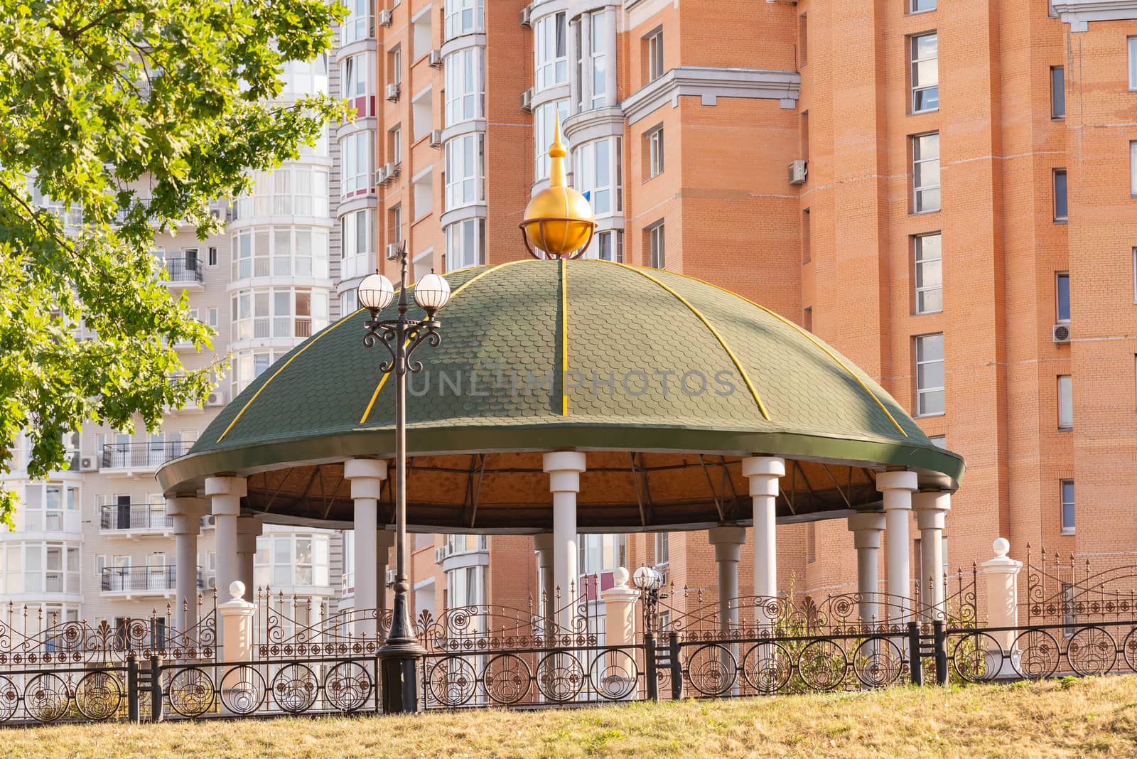 Gazebo in the Naltalka park of Kiev, Ukraine, near the high buildings of the Obolon district