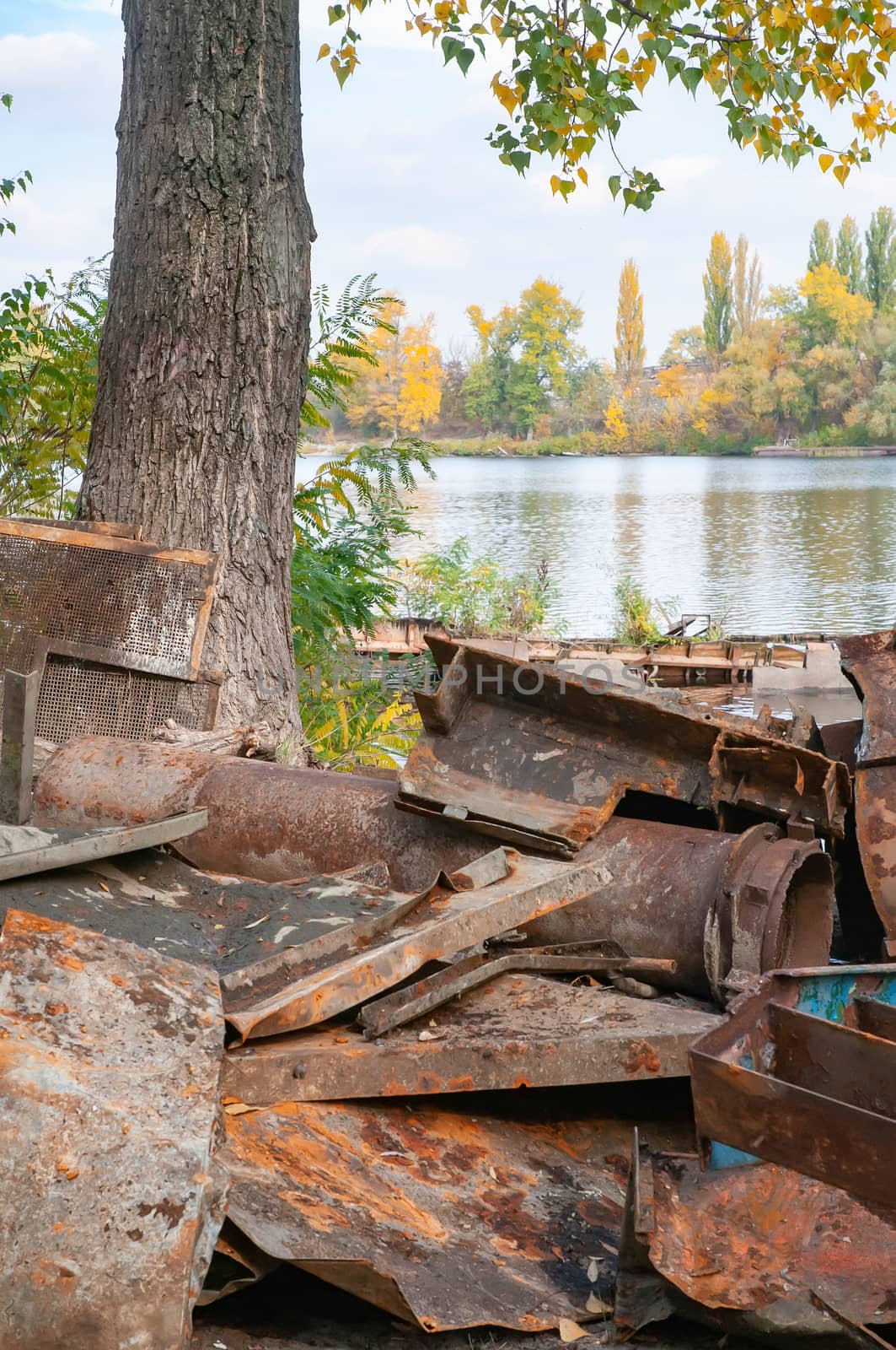 Rust metal pieces dump, probably an old broken boat, close to the Dnieper river in Kiev, Ukraine.