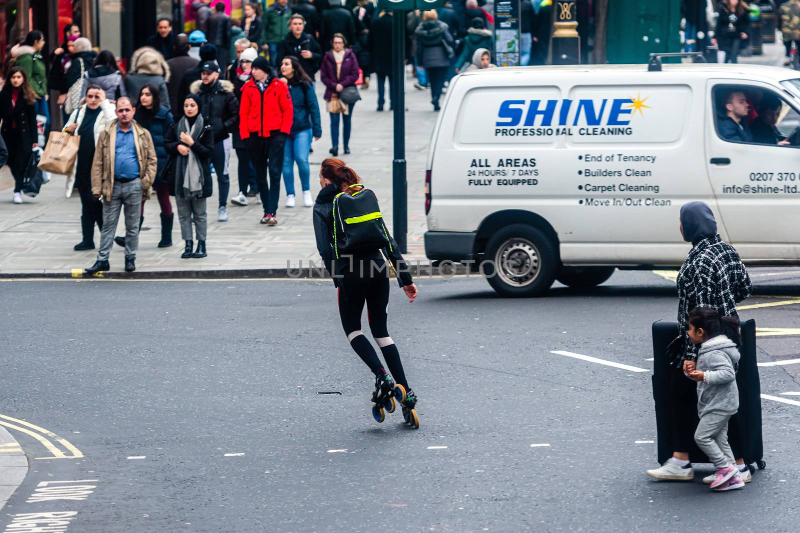 London, England, UK - January 2, 2020: women in roller skates at the intersection of central London streets