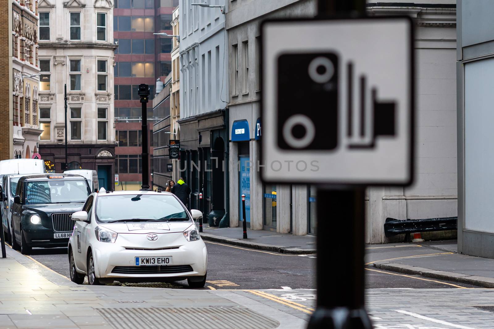 London, England, UK - December 31, 2019: A car with a speed camera on the roof records violations on city street