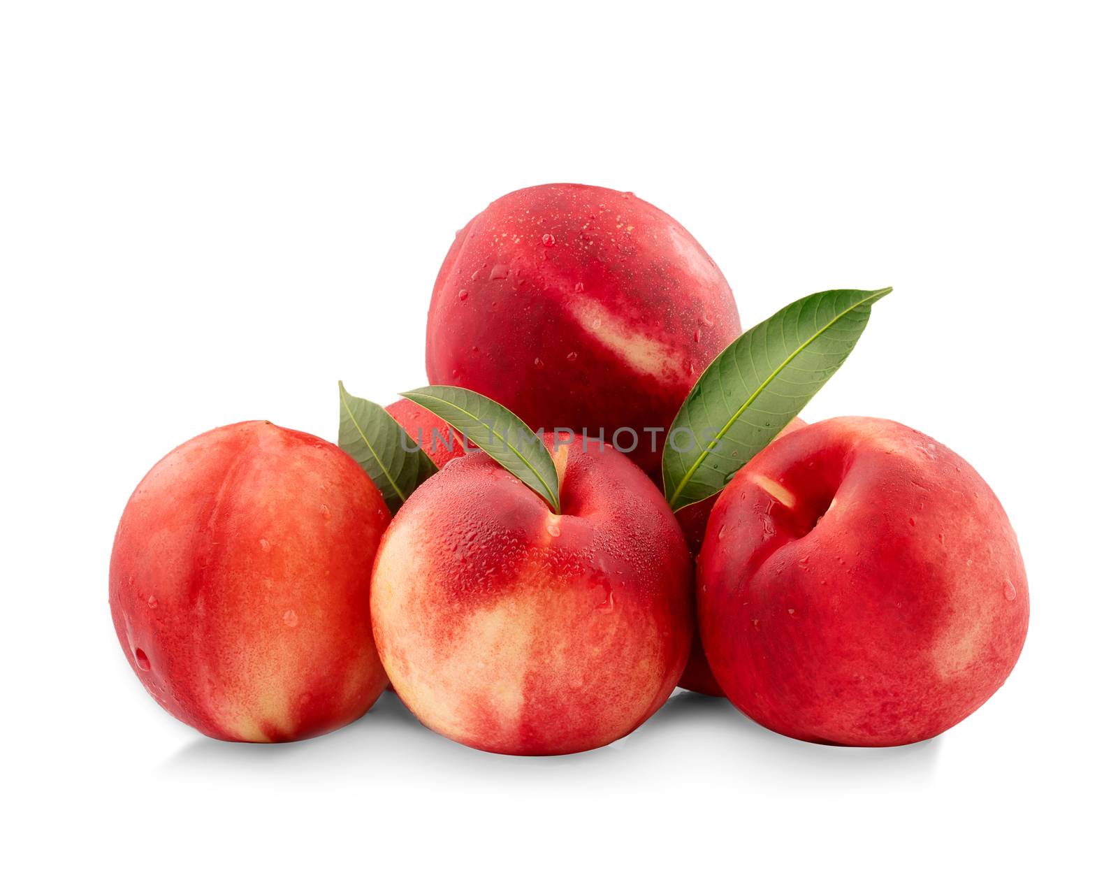 Nectarine peaches with slice and leaf isolated on white background