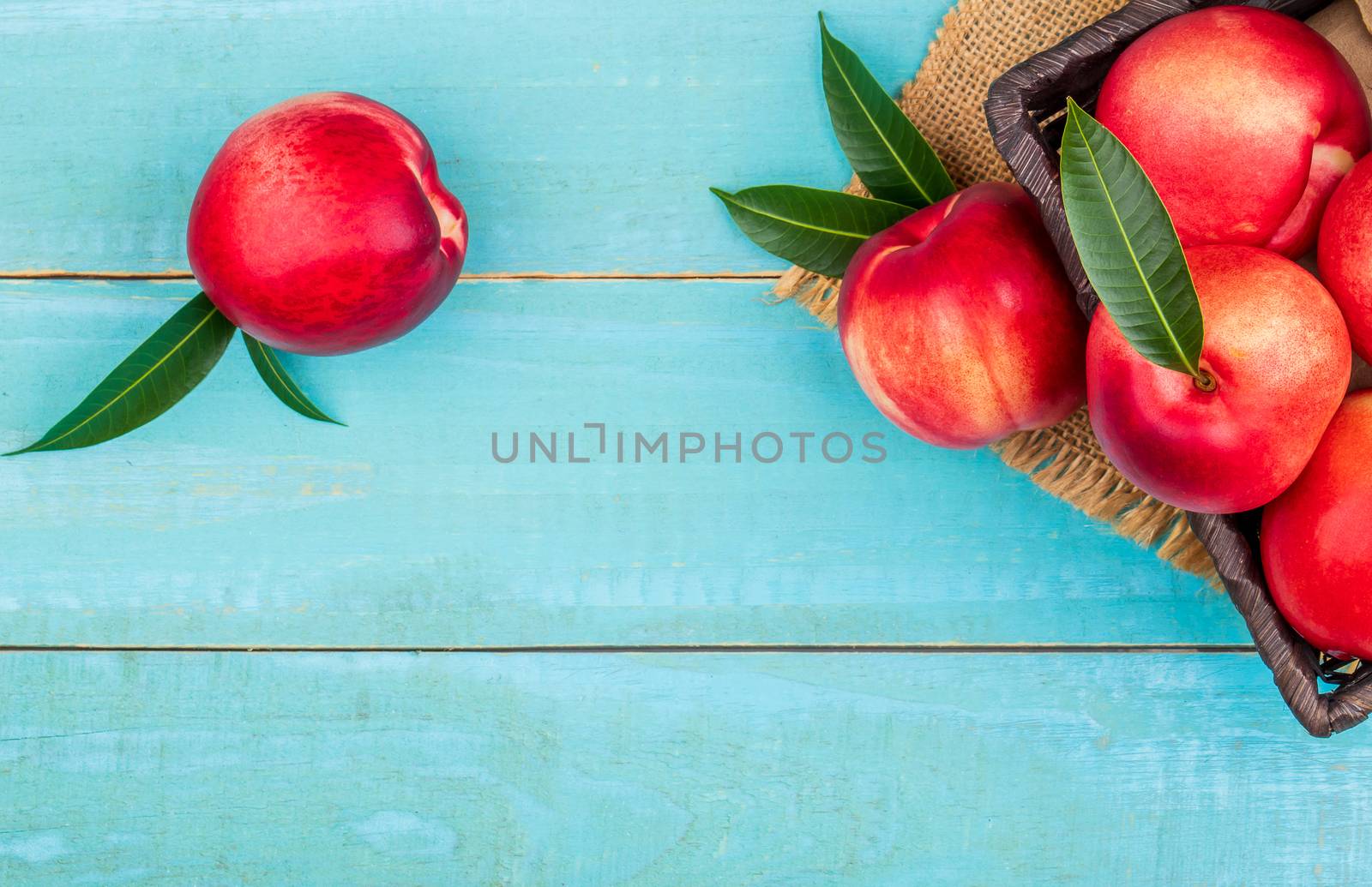 Sweet nectarine on wooden background by freedomnaruk