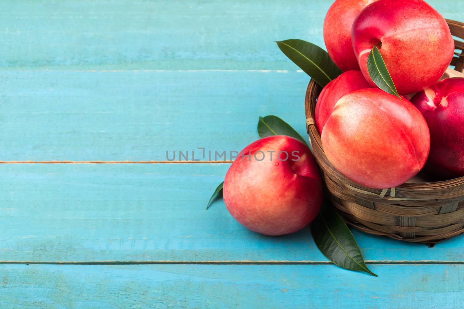 Sweet nectarine on wooden background by freedomnaruk