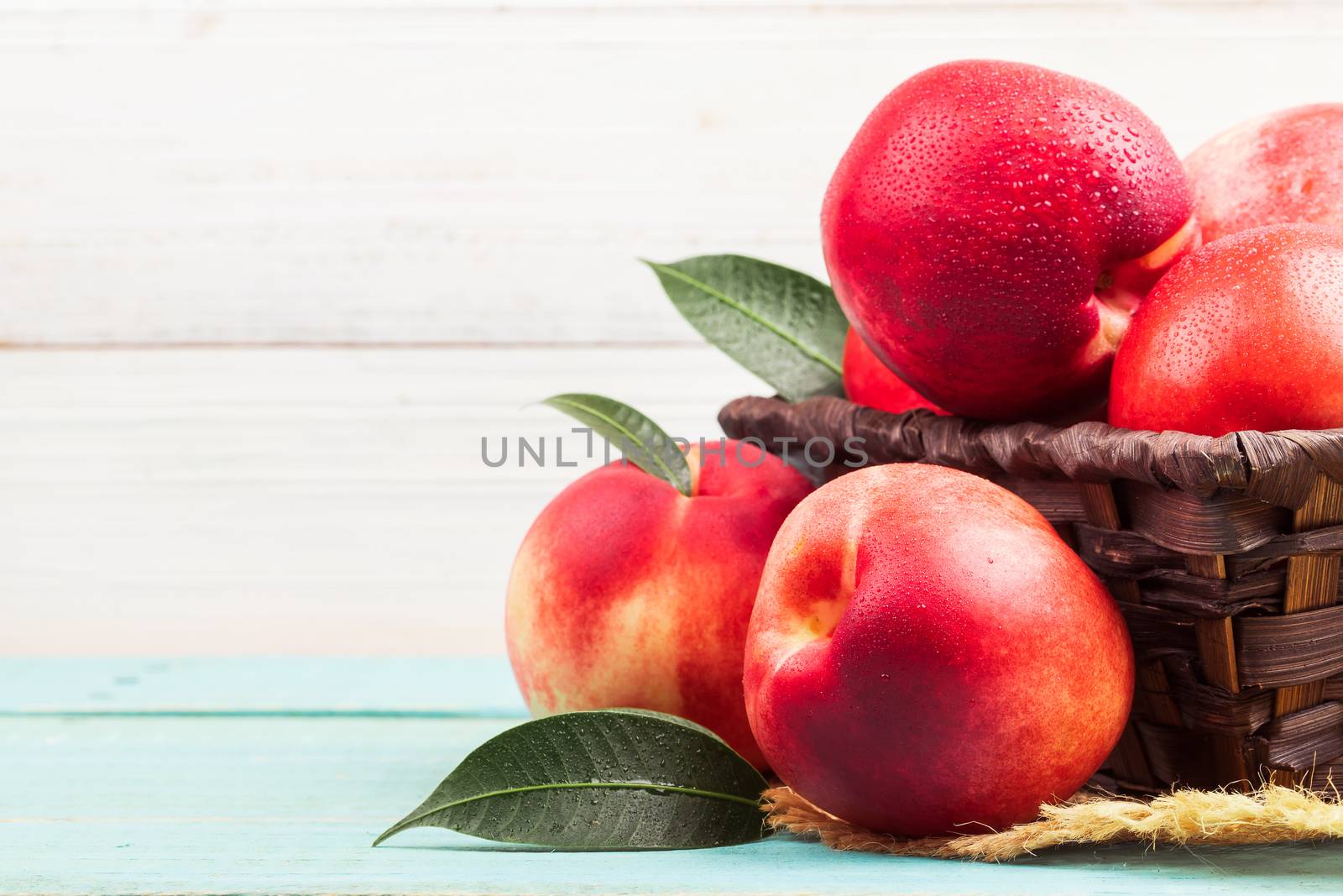 Sweet nectarine on wooden background by freedomnaruk