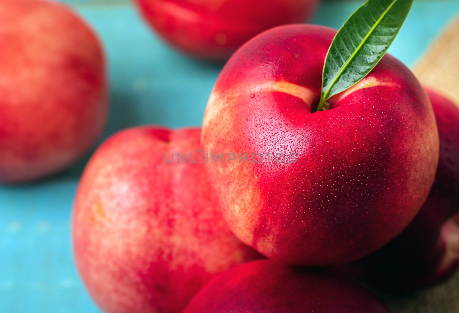 Sweet nectarine on wooden background by freedomnaruk