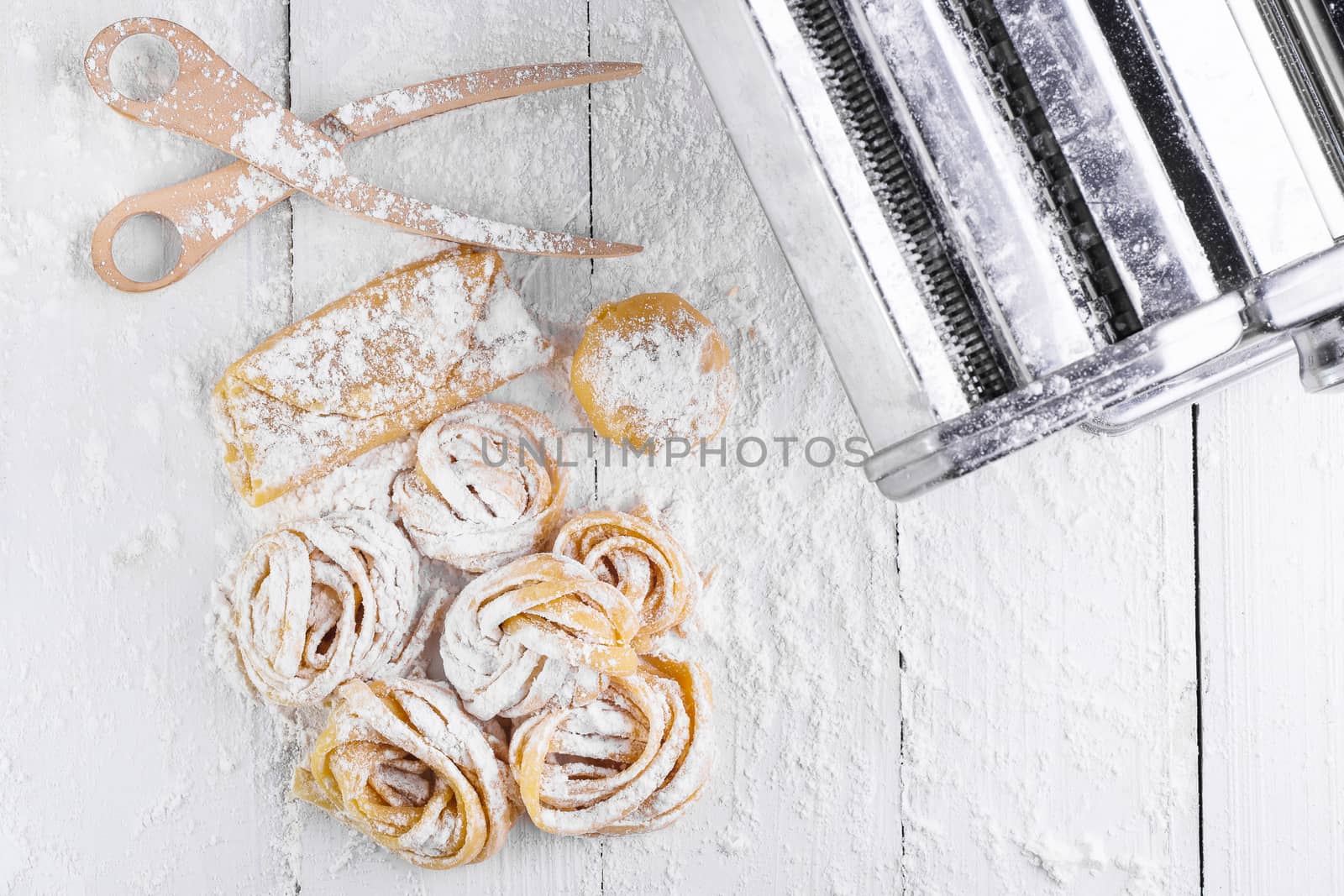 pasta with pasta ingredients on the dark wooden table top view by freedomnaruk