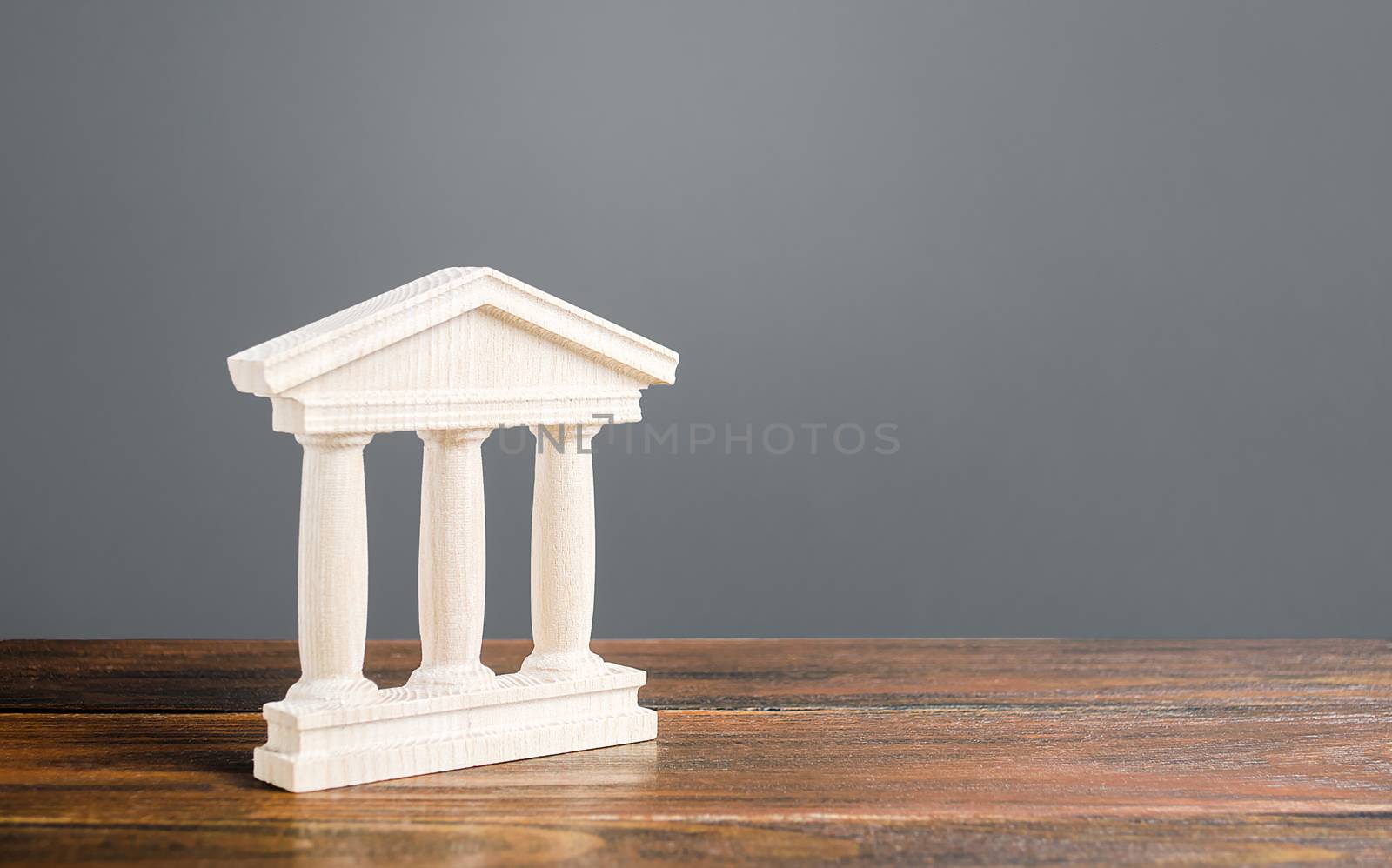 White building figurine with pillars in antique style. Concept of city administration, bank, university, court or library. Architectural monument in old town part . Banking, education, government. by iLixe48