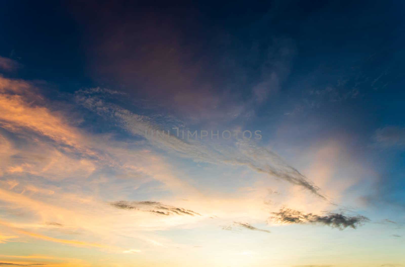 colorful dramatic sky with cloud at sunset
 by freedomnaruk