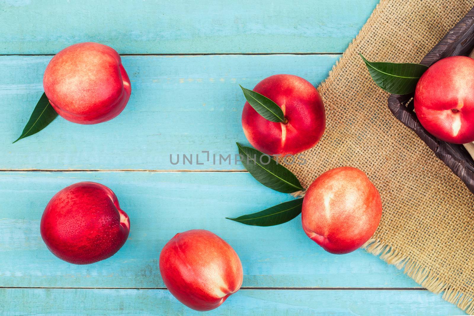 Sweet nectarine on wooden background by freedomnaruk