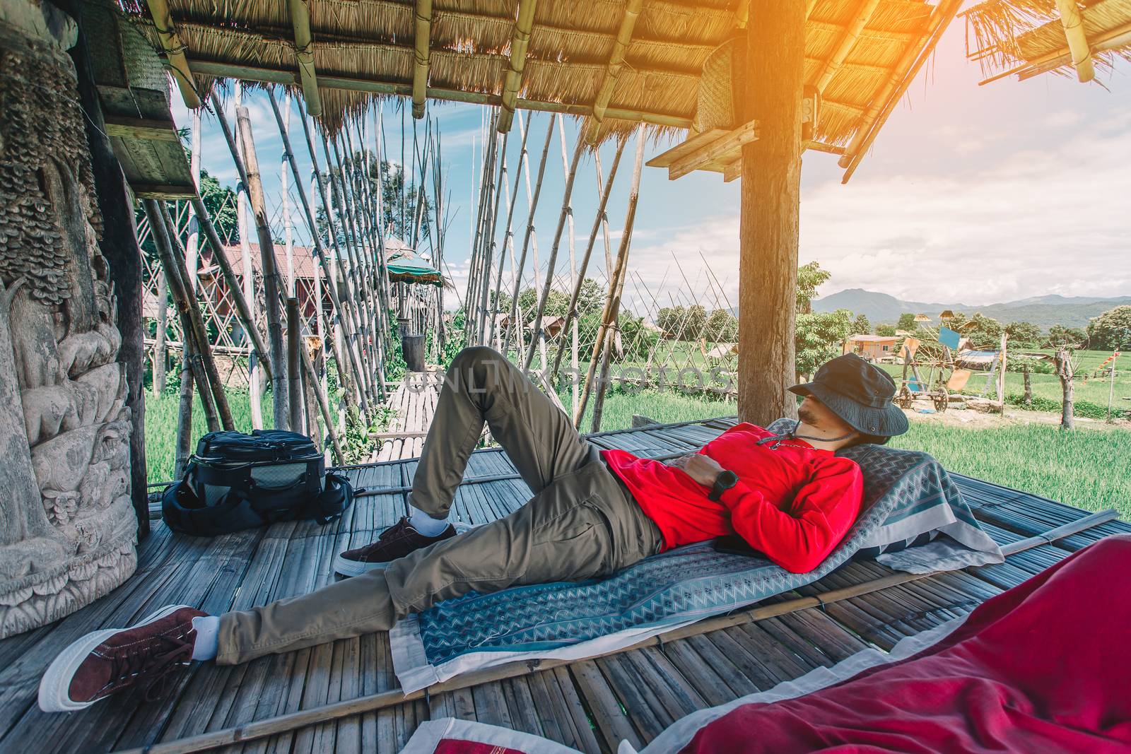 Relaxing moments, Asian relaxing outdoor on the lake in sunset. Relax time on holiday concept travel.