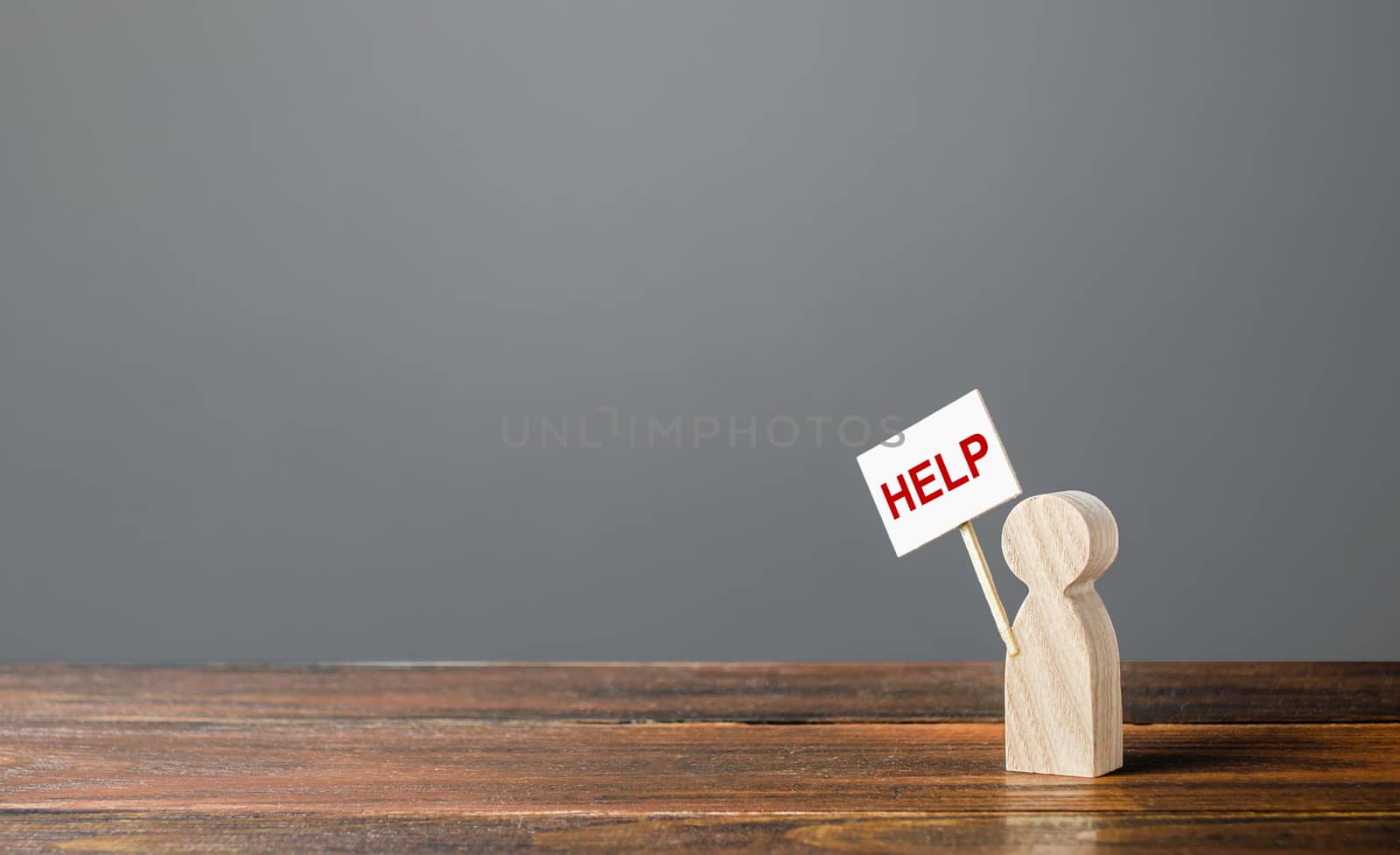 A human figurine asking for help. Support and assistance, providing funding and information to solve social problems. Frequently asked questions, technical support. Psychological service.