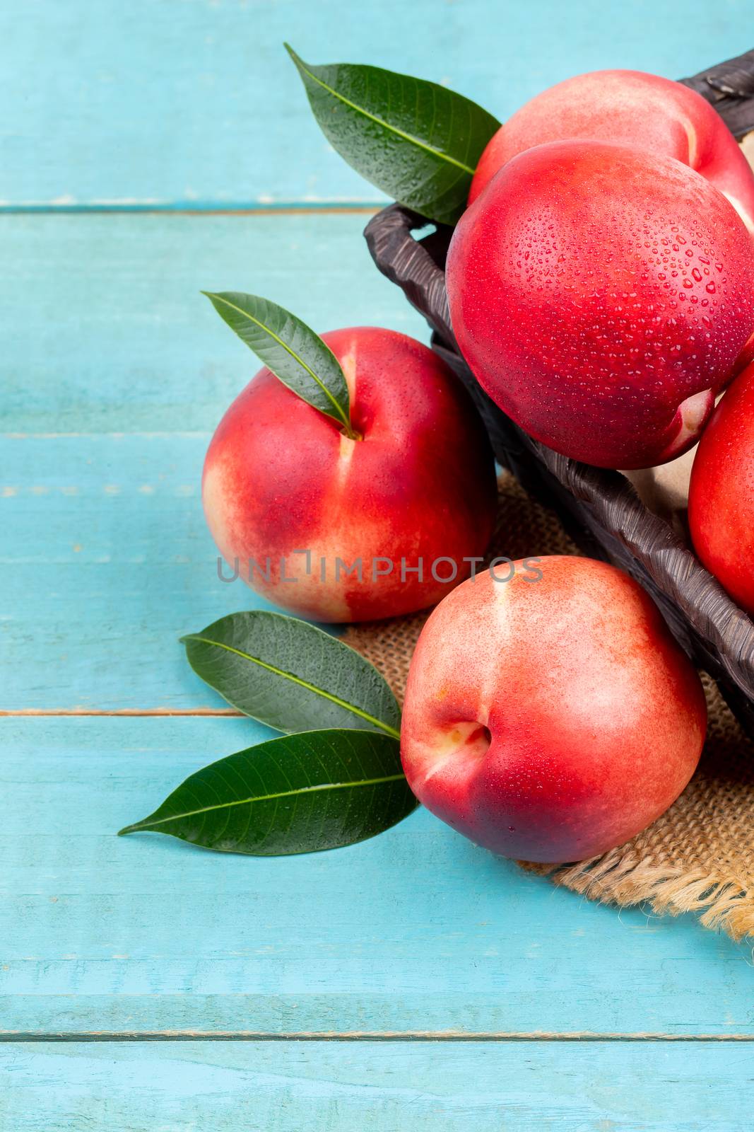 Sweet nectarine on wooden background by freedomnaruk