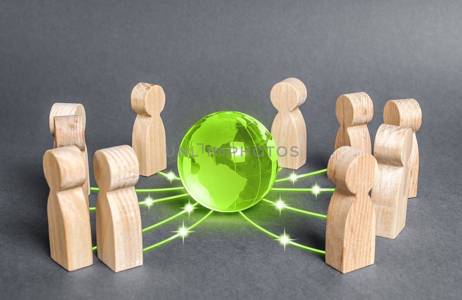 People surrounded a green globe planet earth. Cooperation and collaboration of people around the world. Outsourcing and joint work on projects. Diplomacy. crowdfunding. Preserving environment by iLixe48