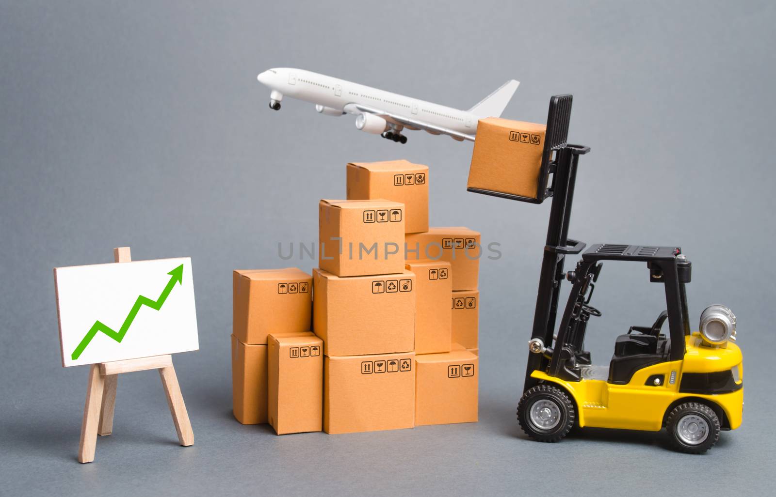 Cargo airplane, forklift truck with cardboard boxes and green arrow up. Increase freight transportation and delivery volumes of products goods. orders growth and throughput of transport infrastructure