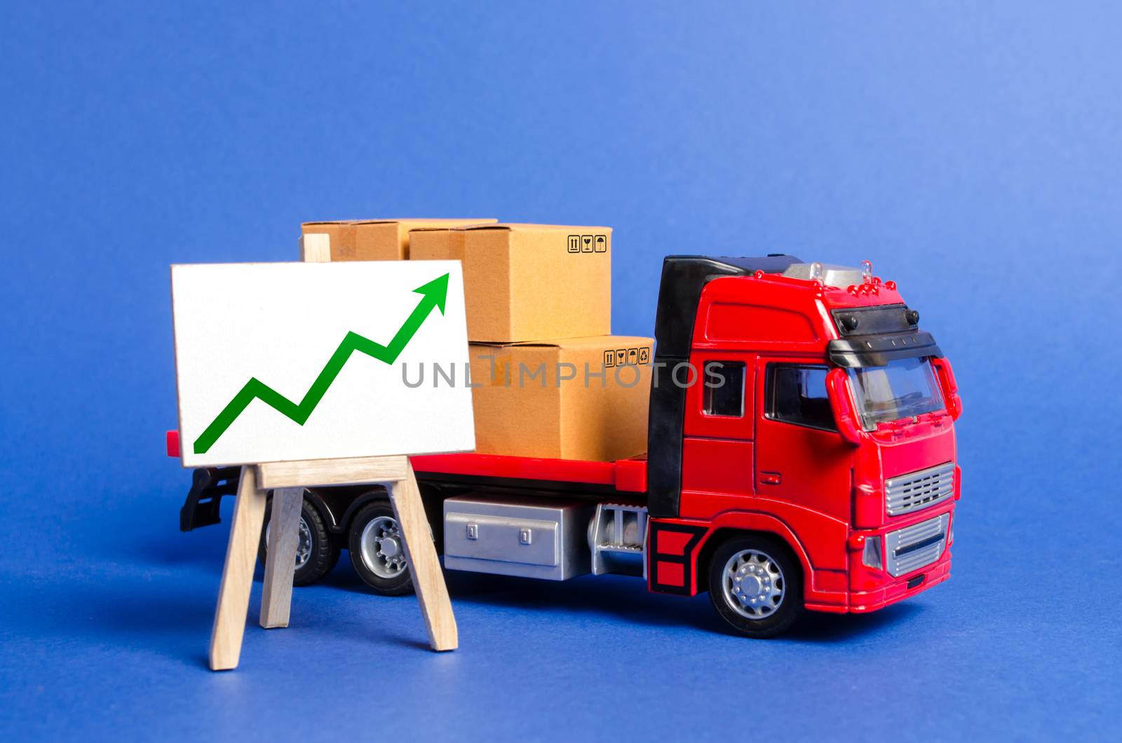 Red truck loaded with boxes and stand with a green up arrow. Raise economic indicators and sales. Exports, imports. High trade volumes, growth production, storage infrastructure Transit and delivery by iLixe48