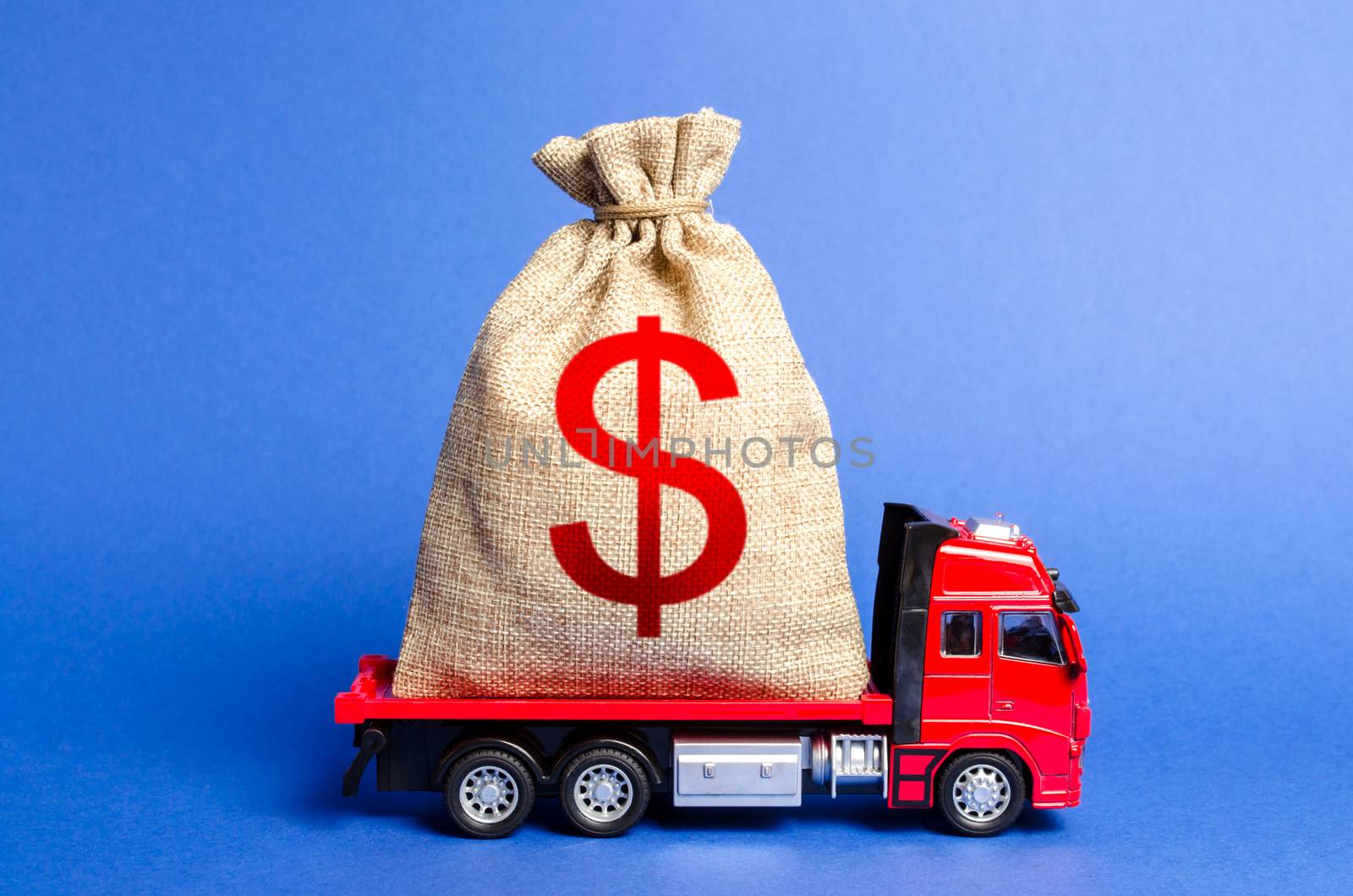 Red truck carries a big bag of money. Attracting investment in development and modernization of production and business projects. Revenue profit. super profit. corruption schemes. Financial groups by iLixe48