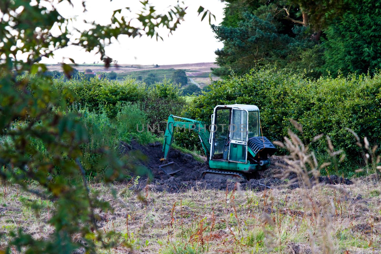 Digger in a farmers field