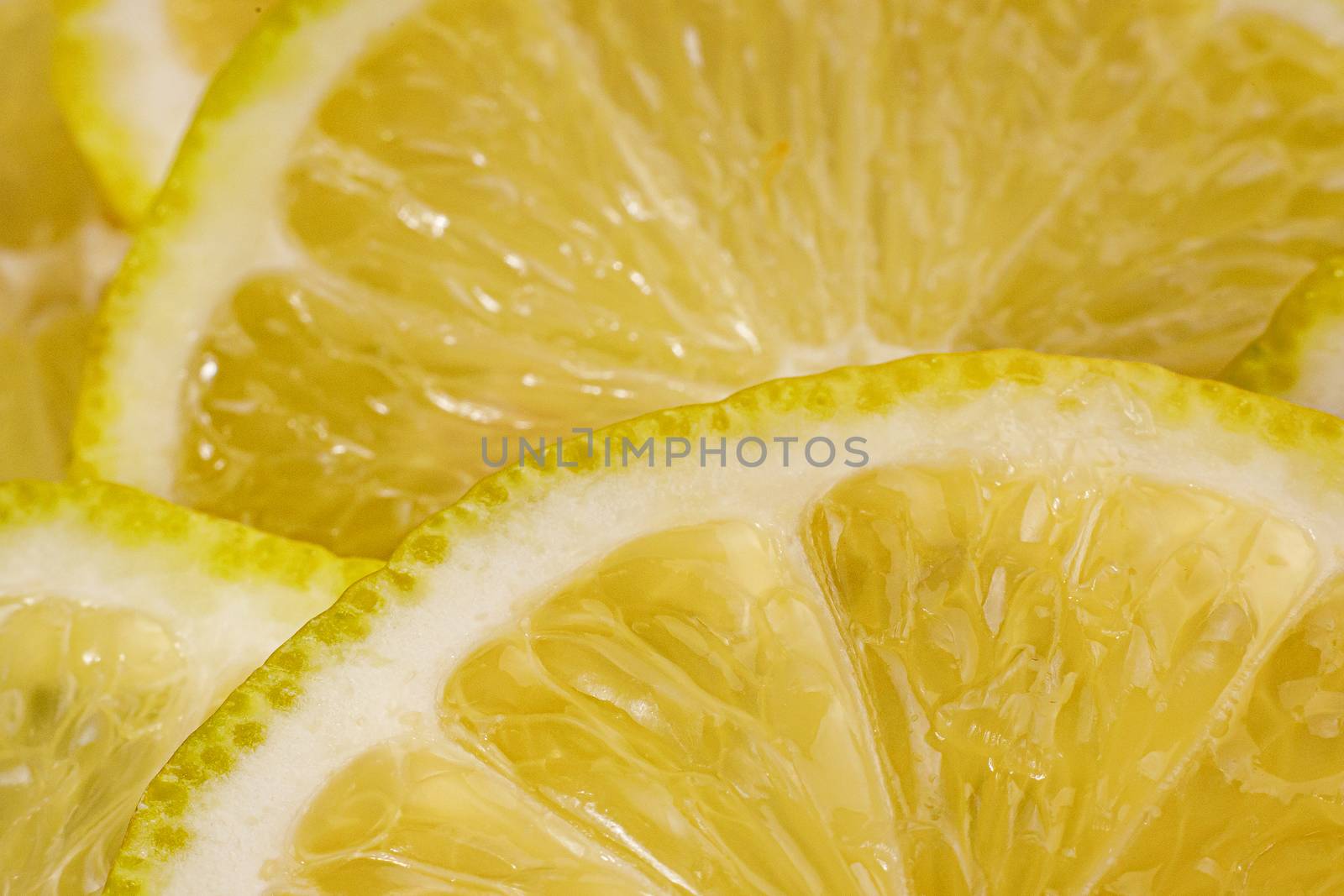 Lemon background. Close up view of lemon slices. Citrus texture. by 9parusnikov