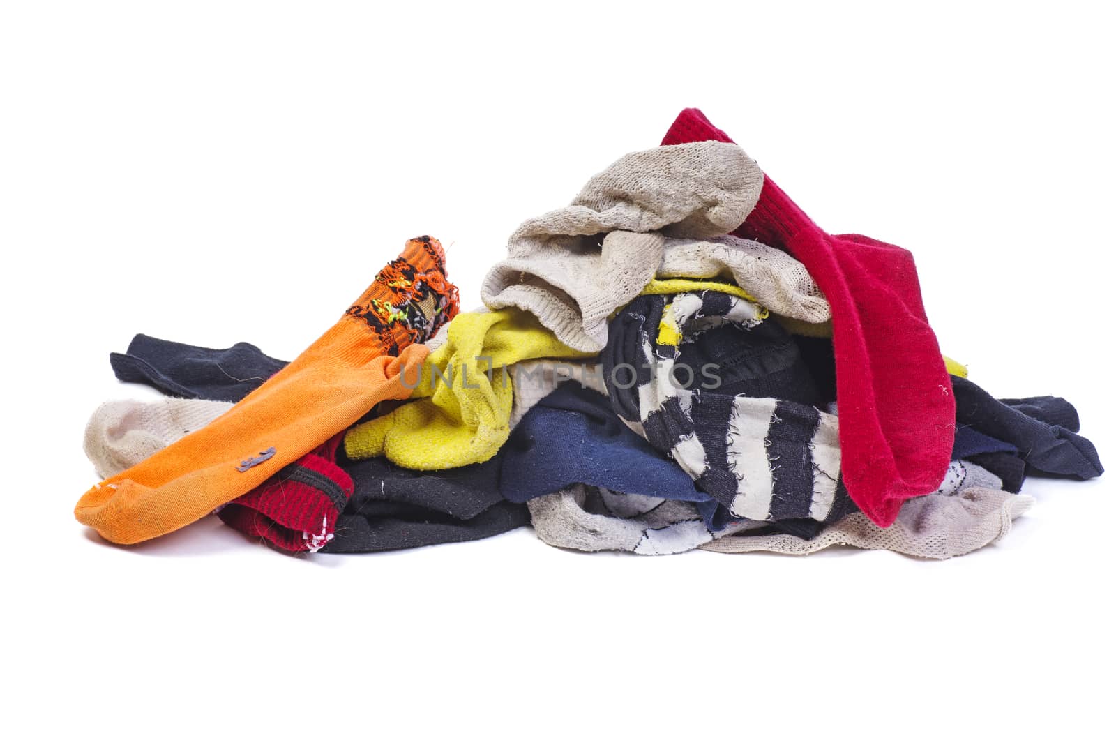 Pile of dirty multicolored socks isolated on a white background