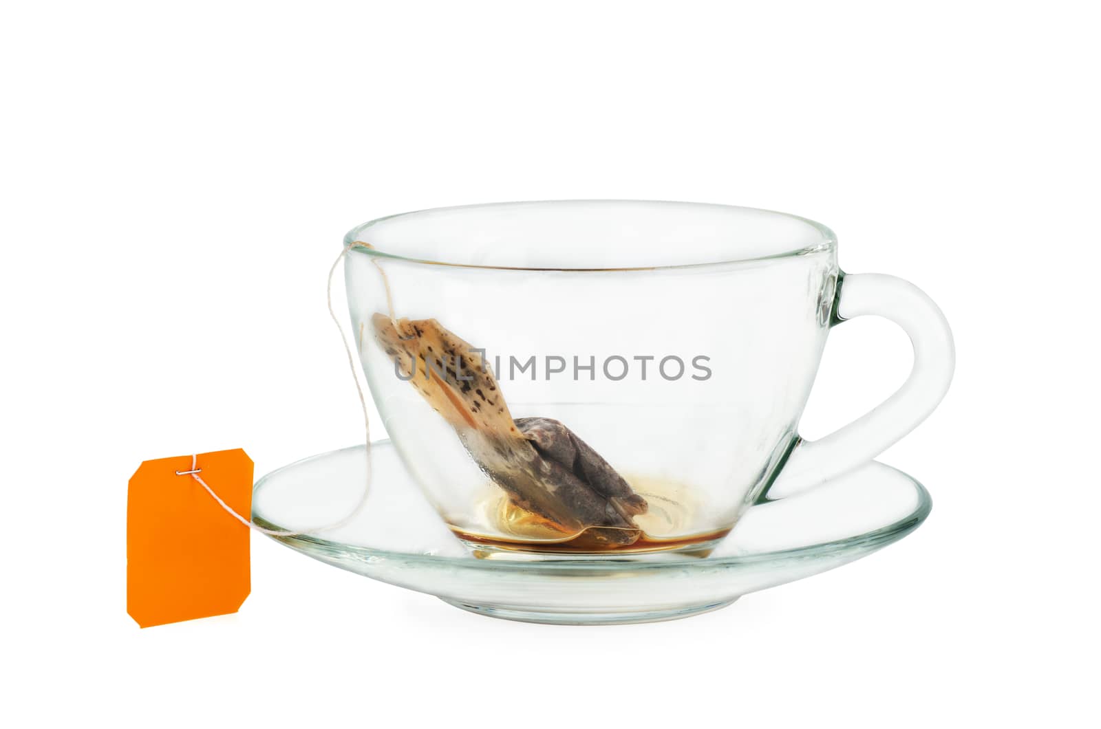 Black tea teabag in empty cup isolated on white background