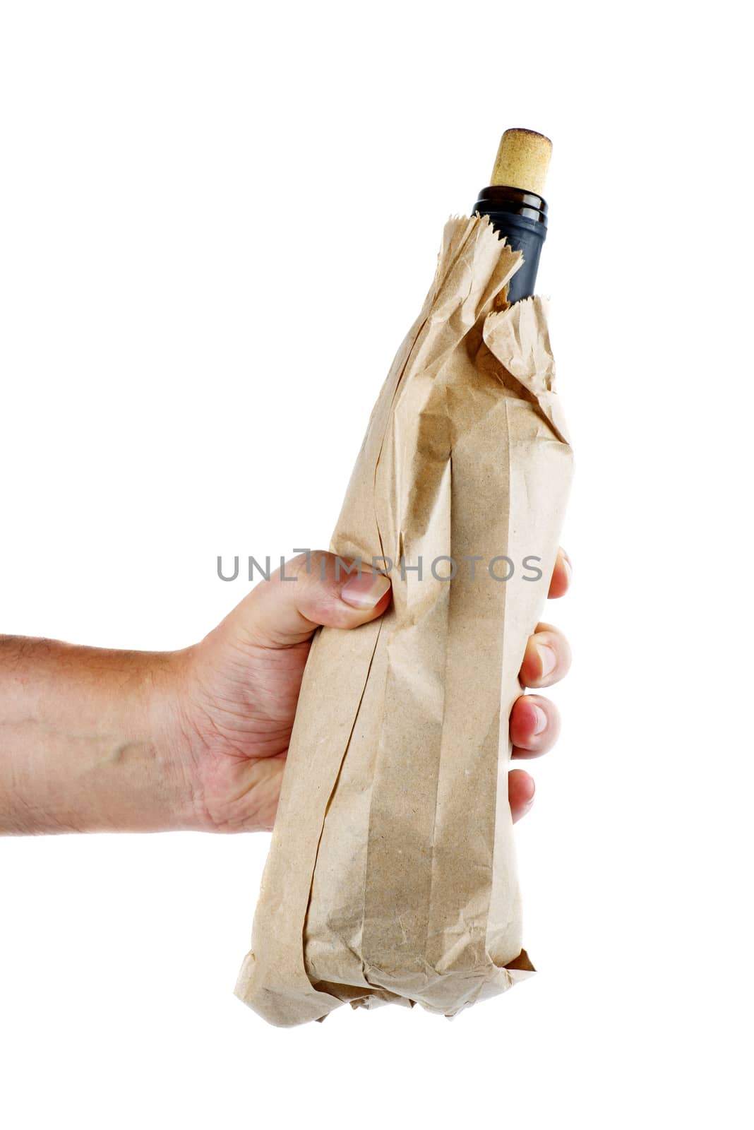 Hand hold wine bottle in brown paper bag isolated on white background