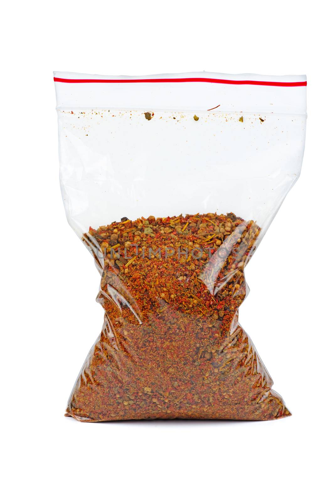 Plastic bag with mixed spices for barbecue isolated on white background