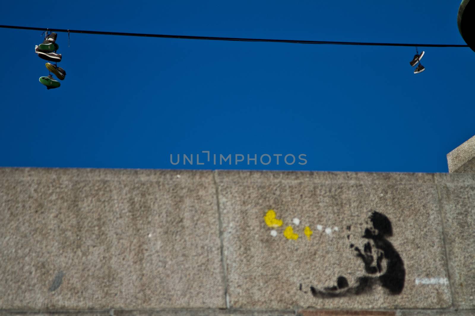 Graffiti on a wall of a boy blowing bubbles