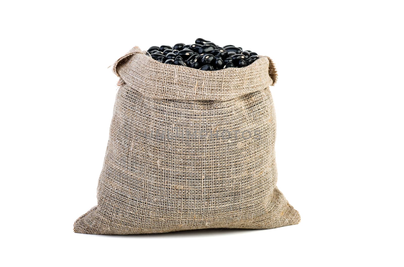 Jute sack with black legume beans isolated on white background