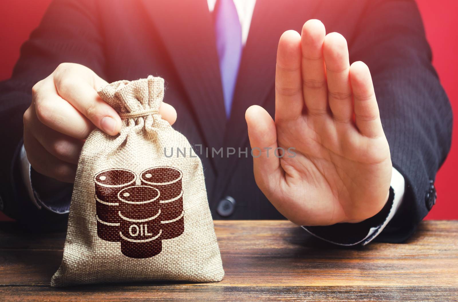 Man refuses to give a bag with oil barrel icon. Refusal to purchase, lack of space for savings and storage. Rejection of offers and breaking of agreements between oil producers. loss making production by iLixe48