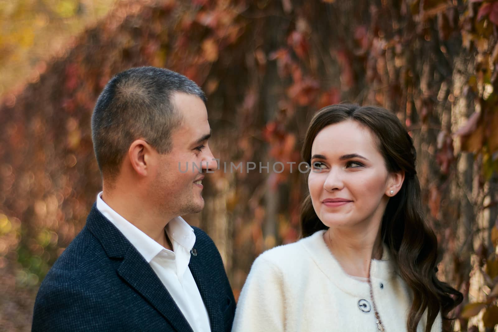 Couple in love close-up portrait. Young male and woman just married. Concept of happy family. Modern family outdoor.