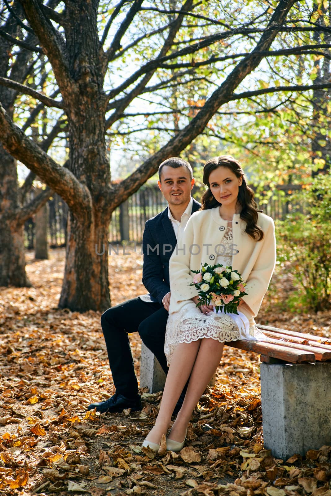 Couple in love close-up portrait. Young male and woman just married. Concept of happy family. Modern family outdoor. Adorable family demonstrate love and care. Autumn vacation.