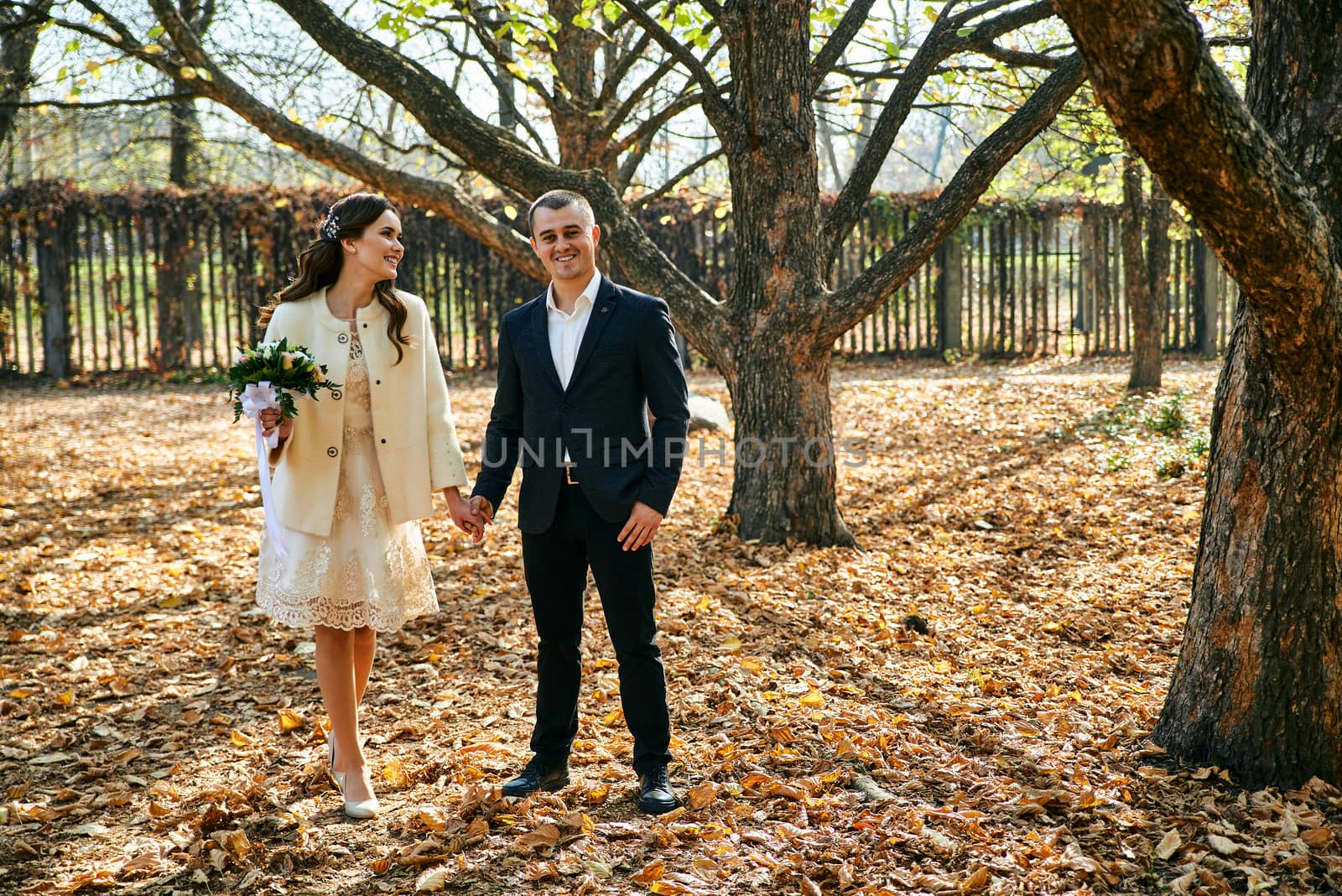 Couple in love close-up portrait. Young male and woman just married. Concept of happy family. Modern family outdoor. Adorable family demonstrate love and care. Autumn vacation.