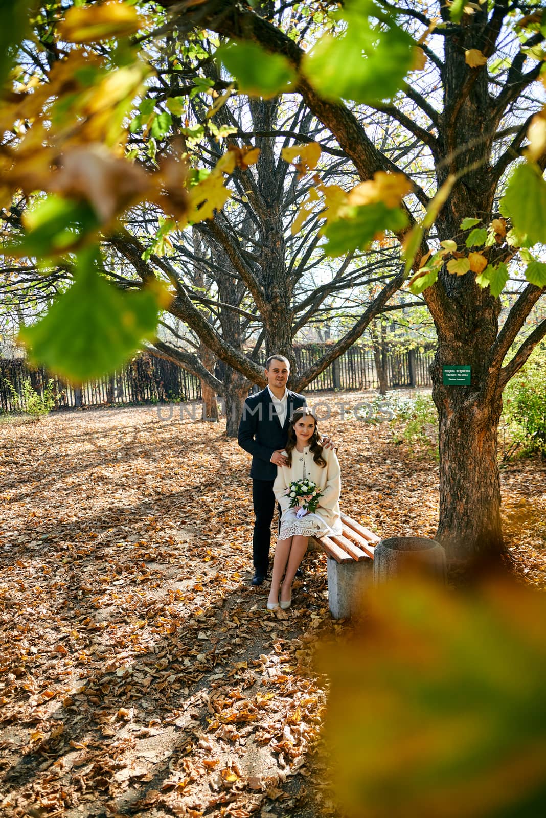 Couple in love close-up portrait. Young male and woman just married. Concept of happy family. Modern family outdoor. Adorable family demonstrate love and care. Autumn vacation.