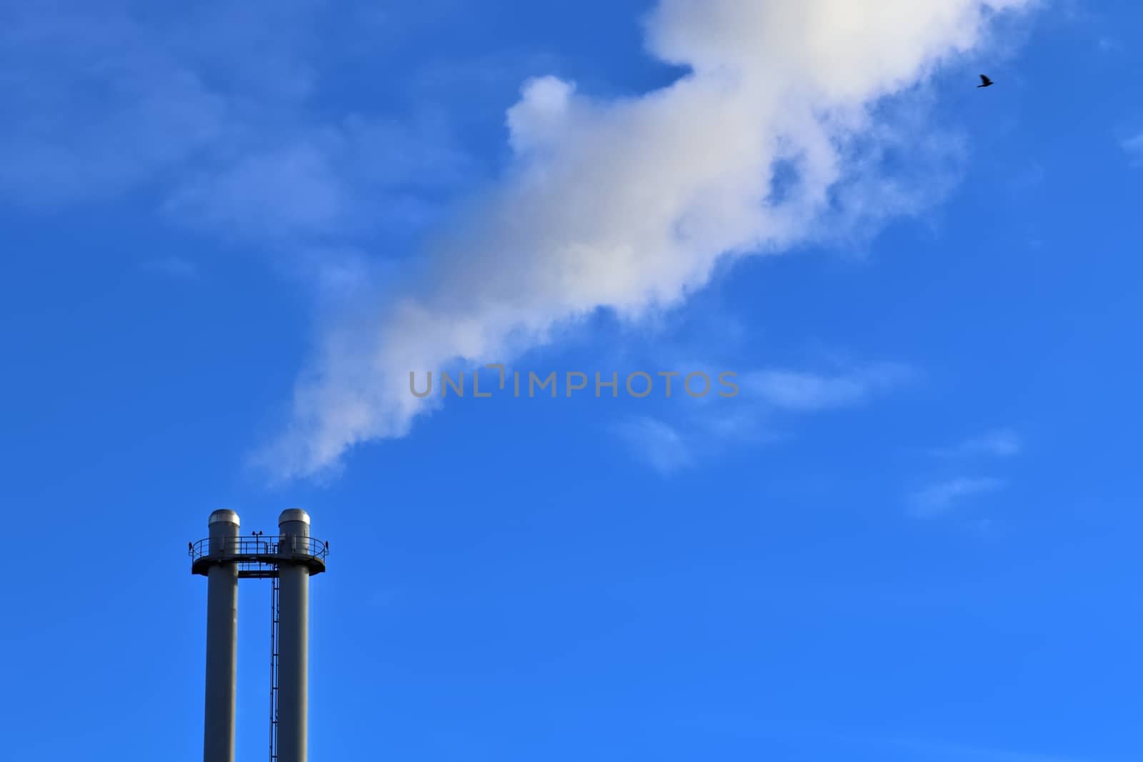 Industry pollution from factory smoestacks in a deep blue sky by MP_foto71