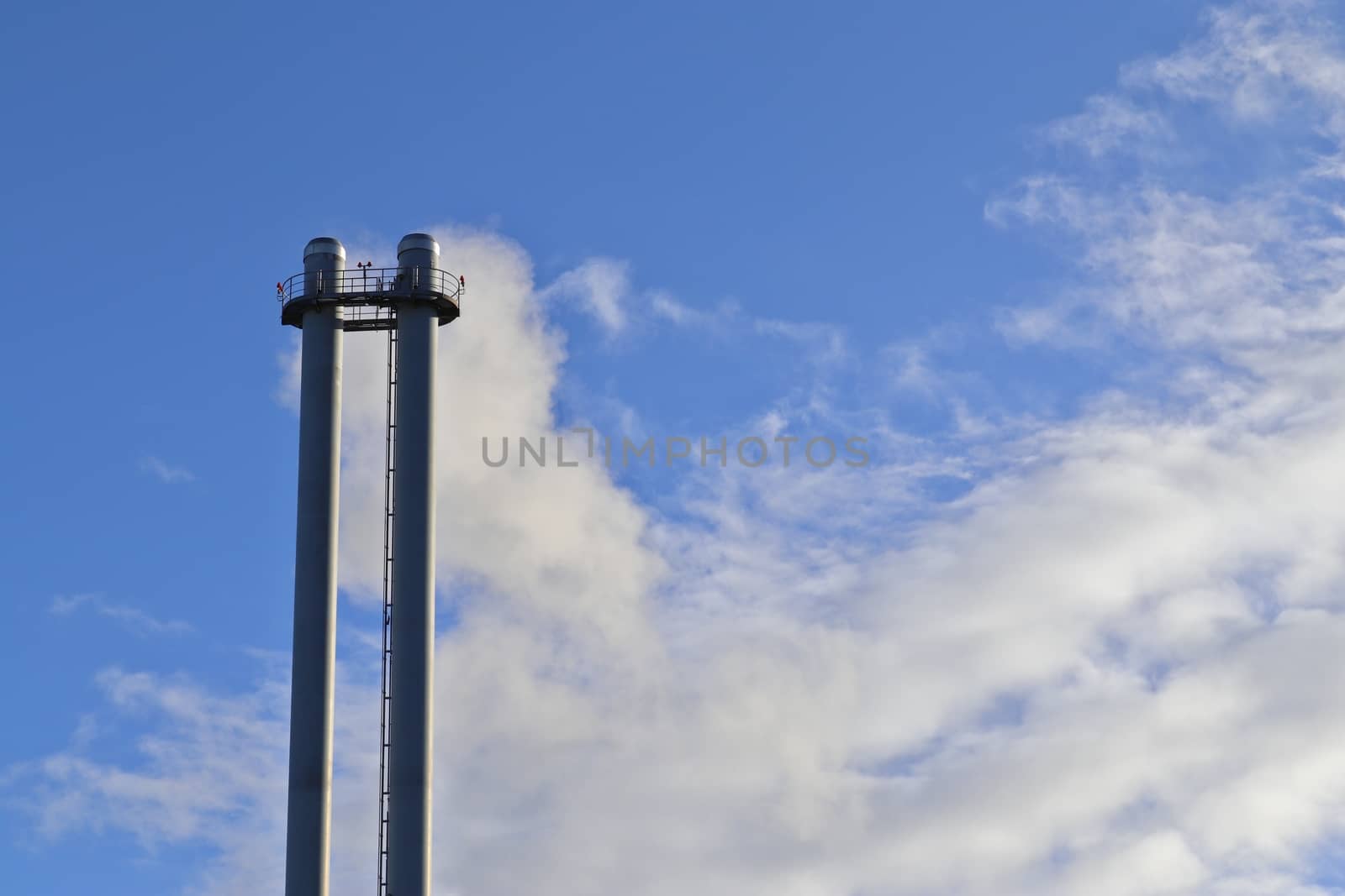 Industry pollution from factories in a blue sky