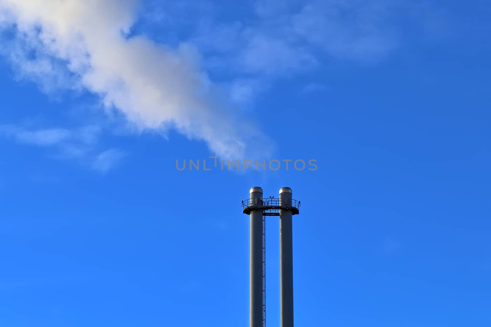 Industry pollution from factories in a blue sky