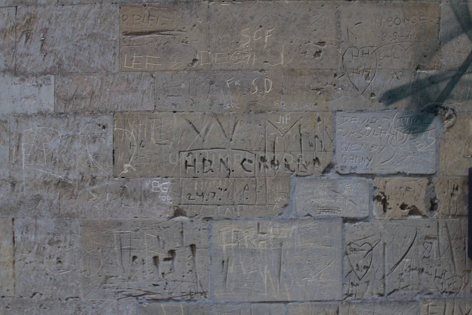 Engraved or Carved Graffiti on a Stone Wall