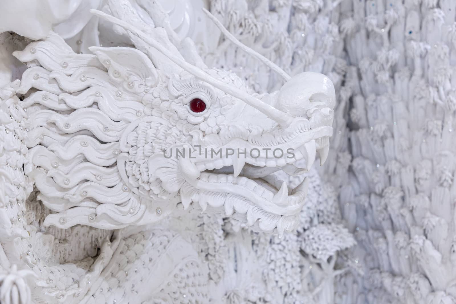 Beautiful White dragon statue at Huay Pla Kang Temple, Chiang Rai, Thailand. by phanthit