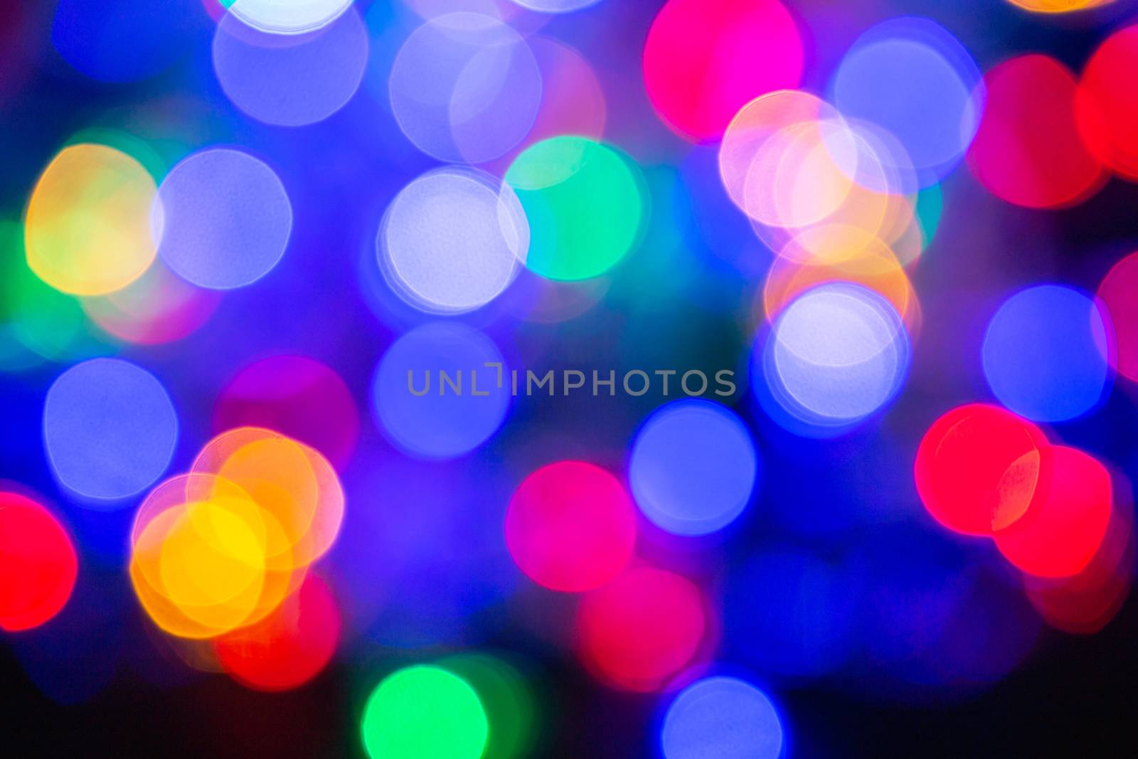 Colorful abstract blurred circular bokeh light of night city street for background. graphic design and website template design. by phanthit