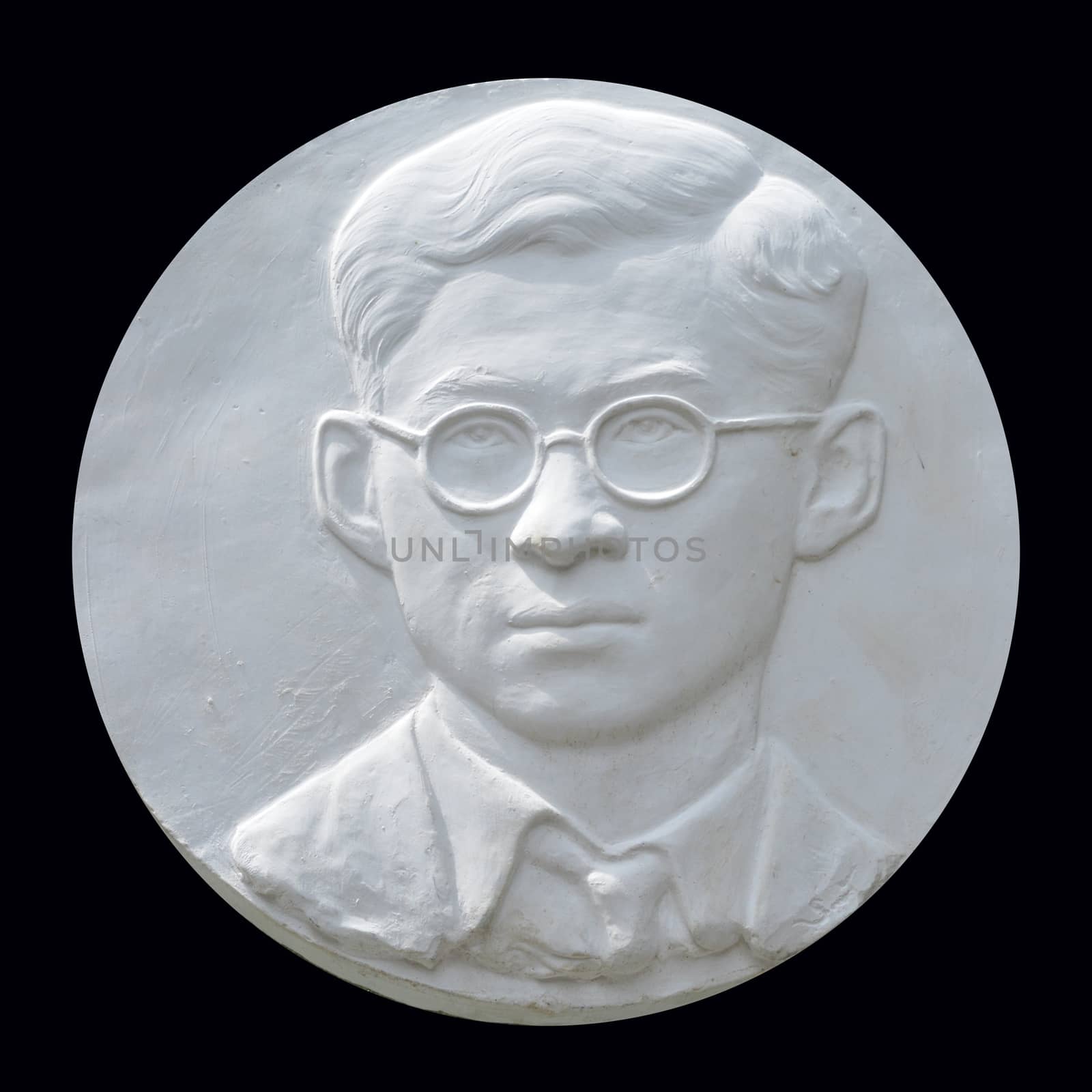 Bangkok, Thailand – November  16,2016 : plaster Bas relief of His Majesty King Bhumibol portrait at the wall in front of the Pohchang Academy Of Arts to art exposition in Bangkok, Thailand.