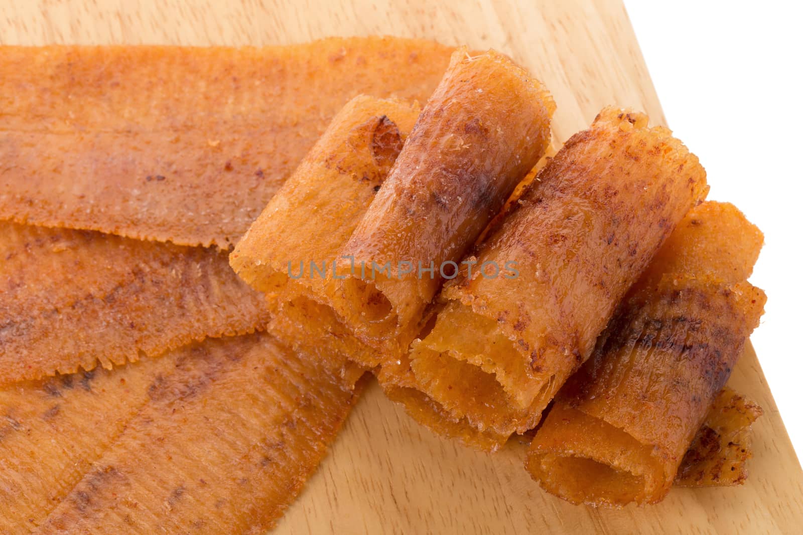 spicy crispy squid isolated white background, squid mashed crispy snack and spicy souvenirs from the sea.