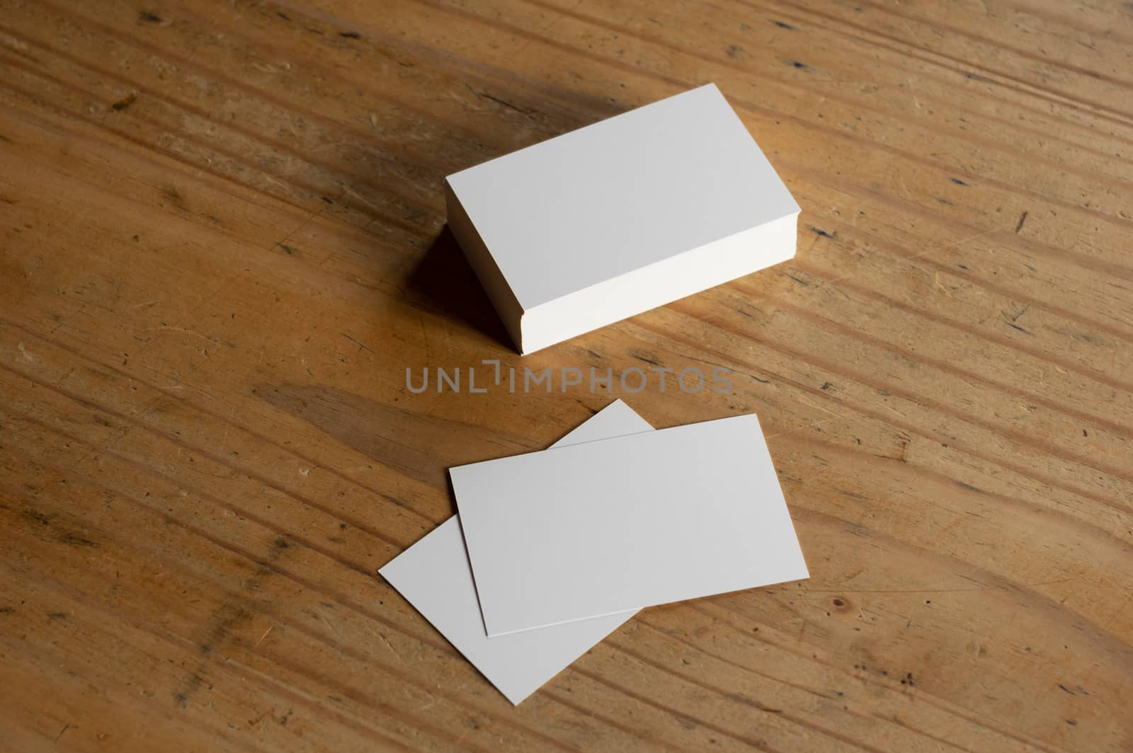 blank business card templates on wooden surface