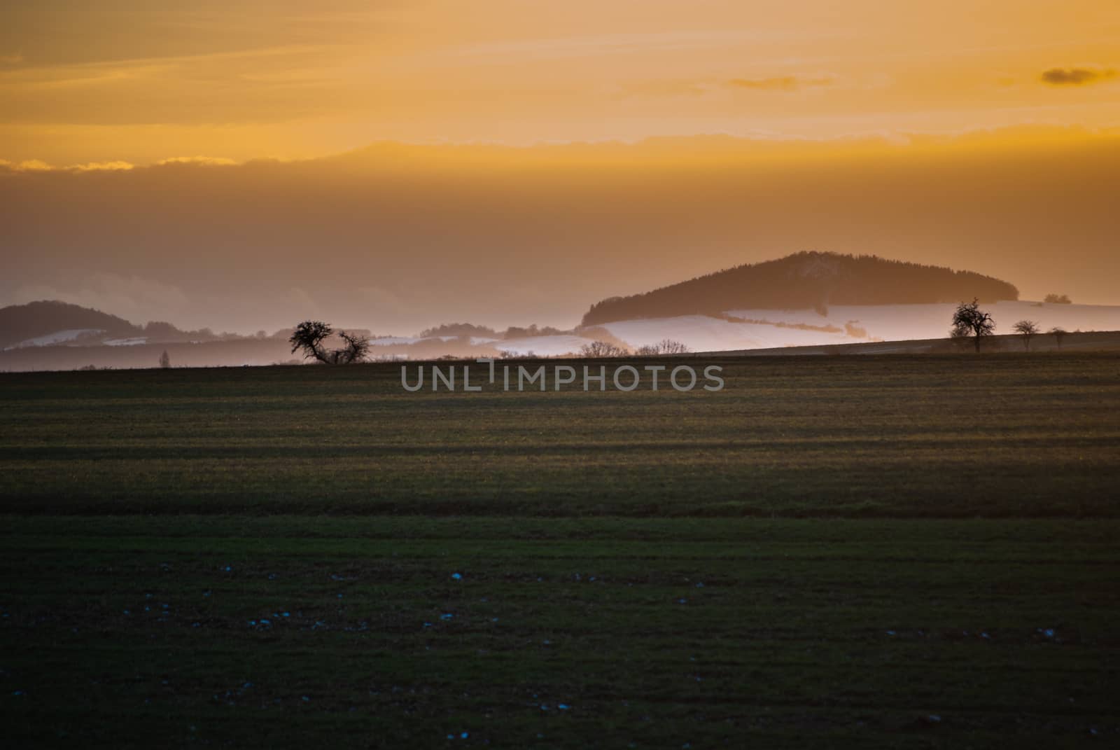 sunset behind a hill in upper lusatia Germany