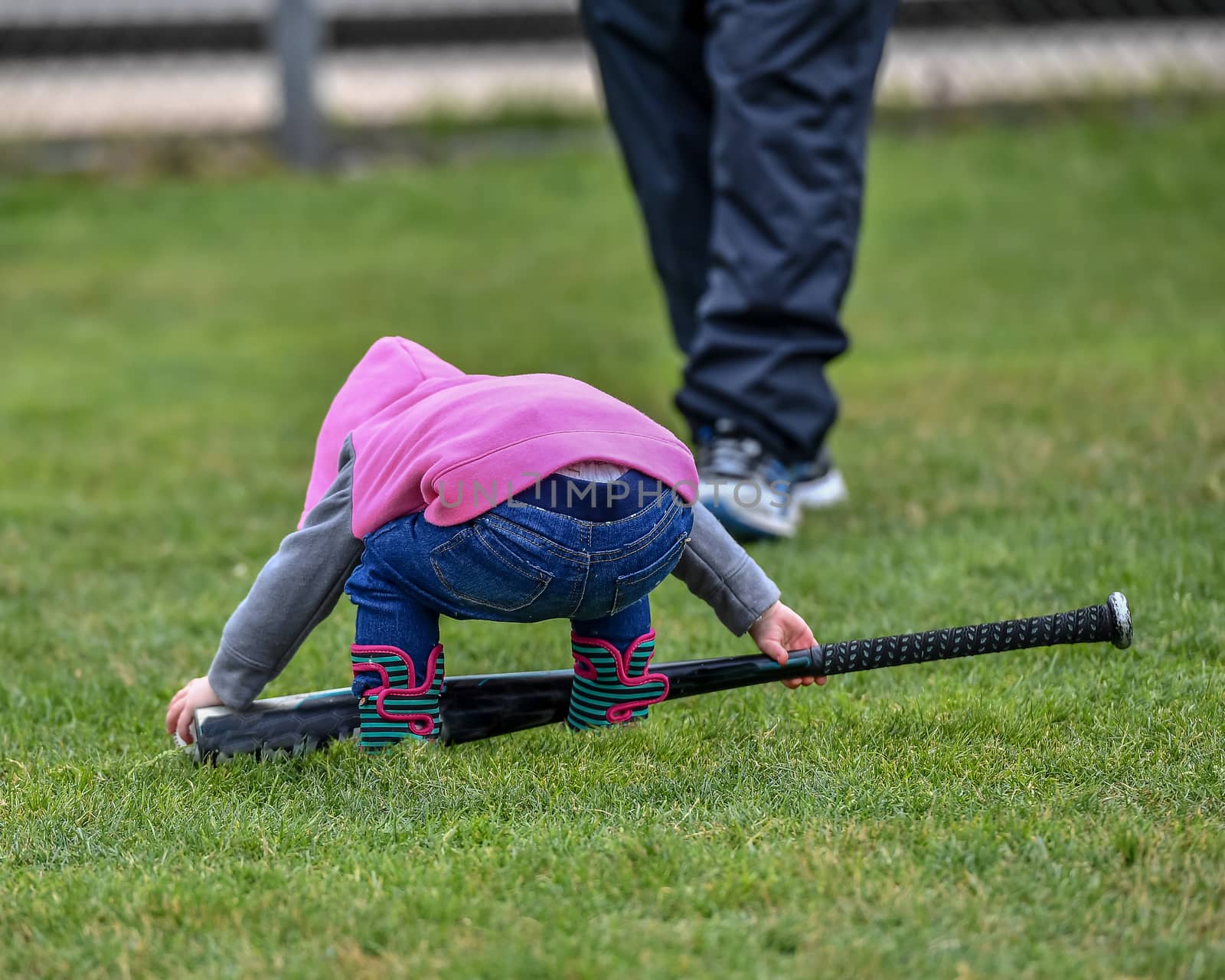 Cute Baby Girl Playing With Baseball Bat and Ball by Calomeni