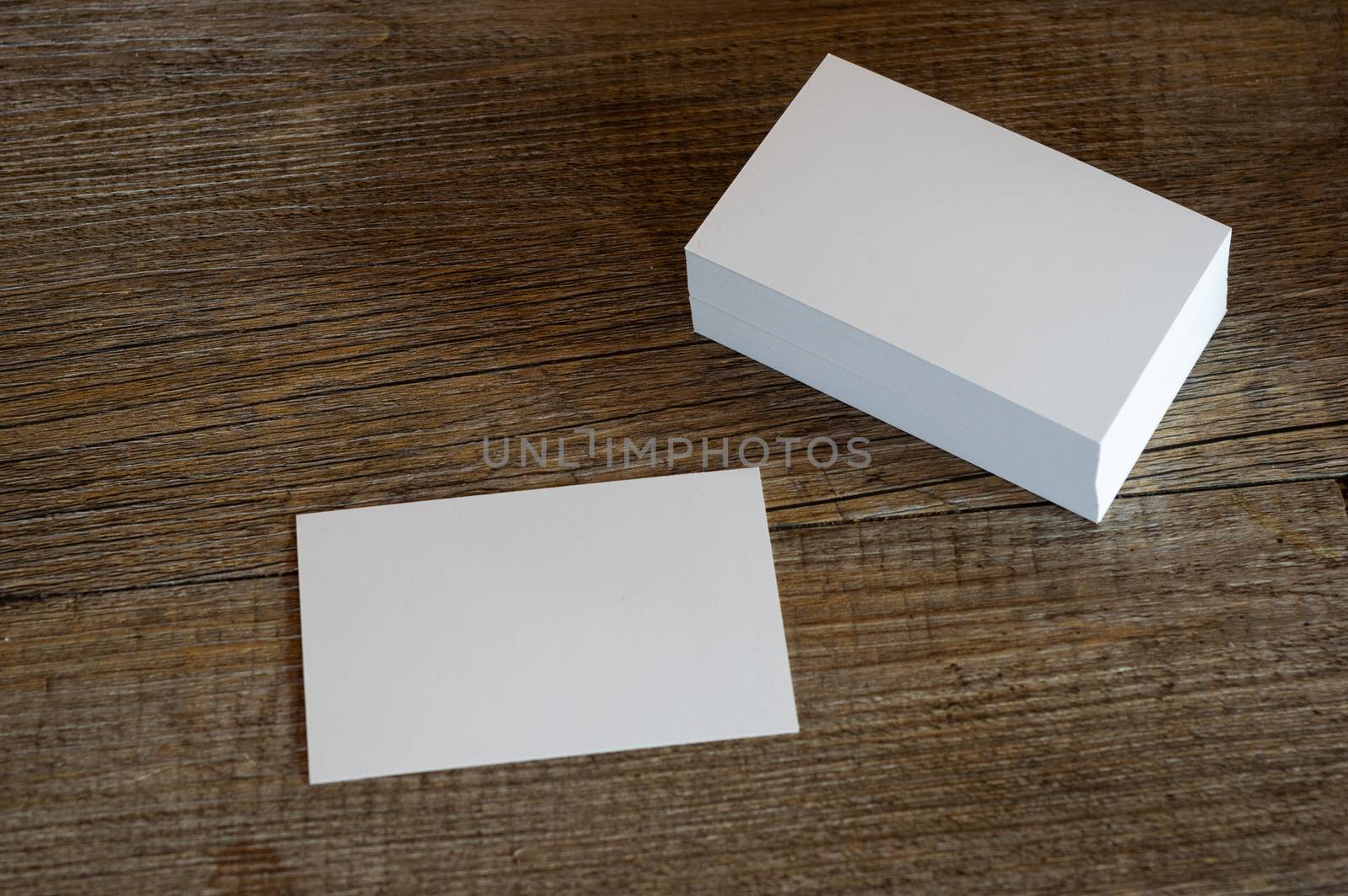 blank business cards on wooden surface