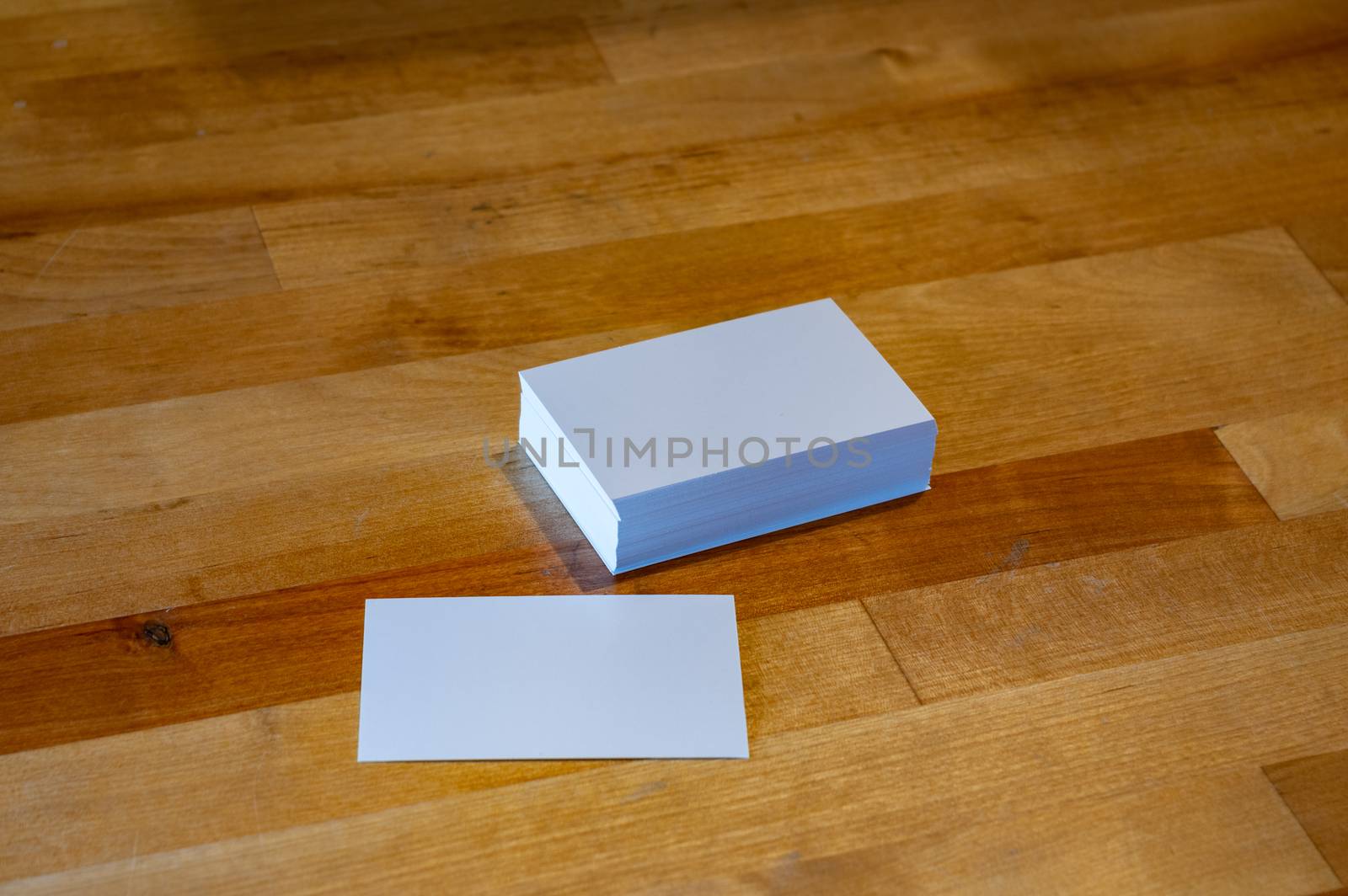 blank business card templates on wooden surface