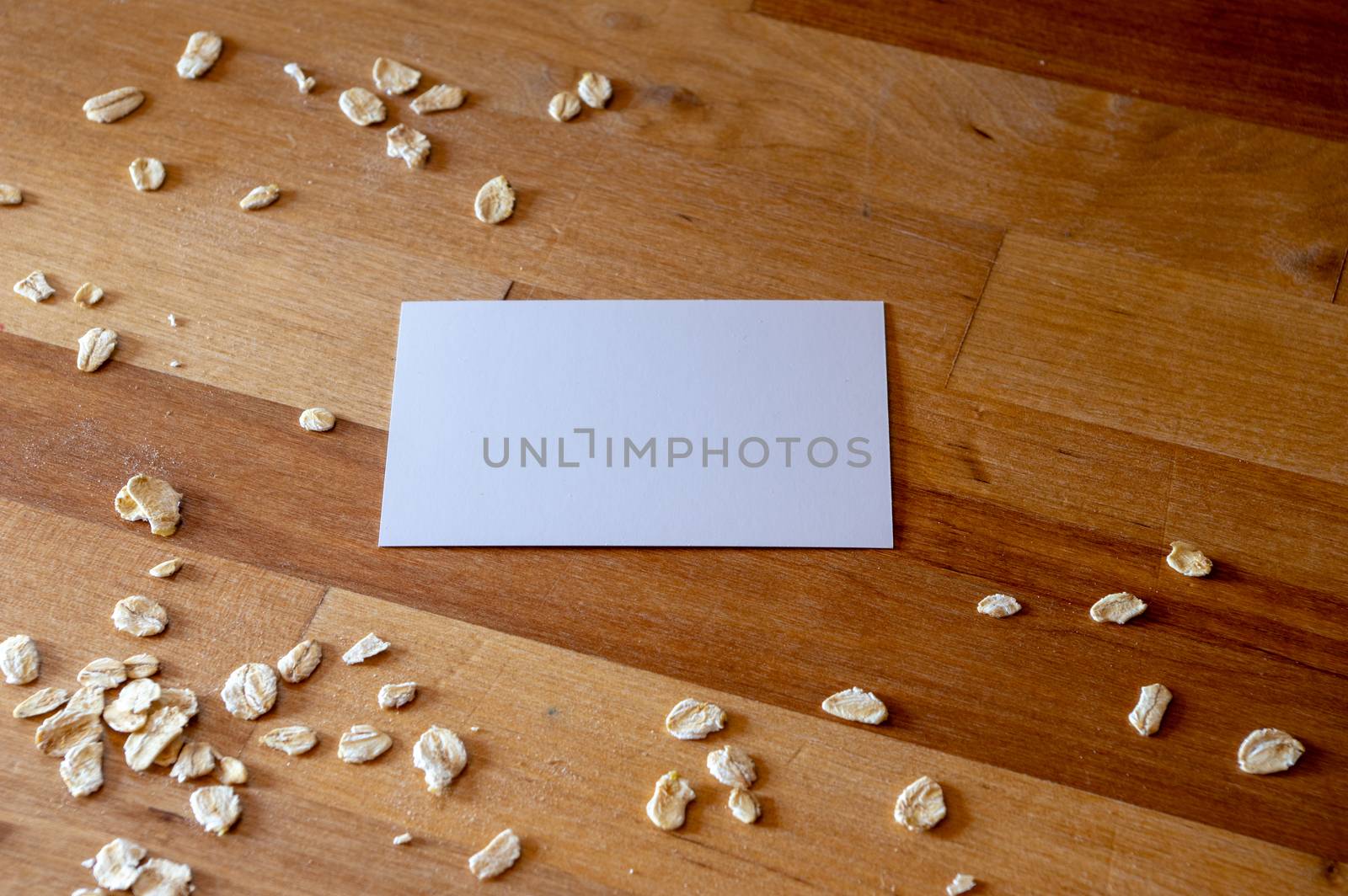 business card mockup templates on a table with sprinkled oatmeal by MarcoWarm