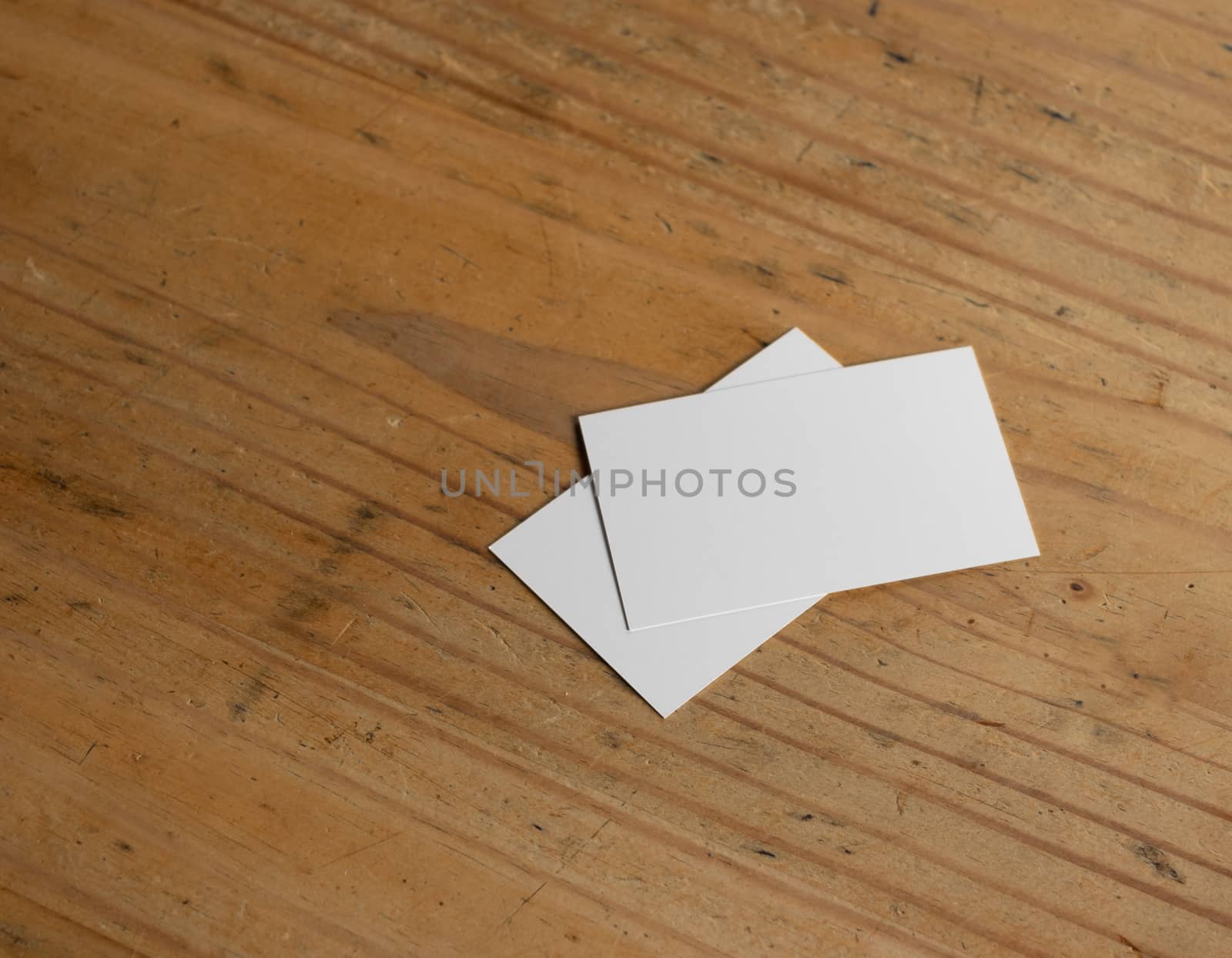blank business card templates on wooden surface
