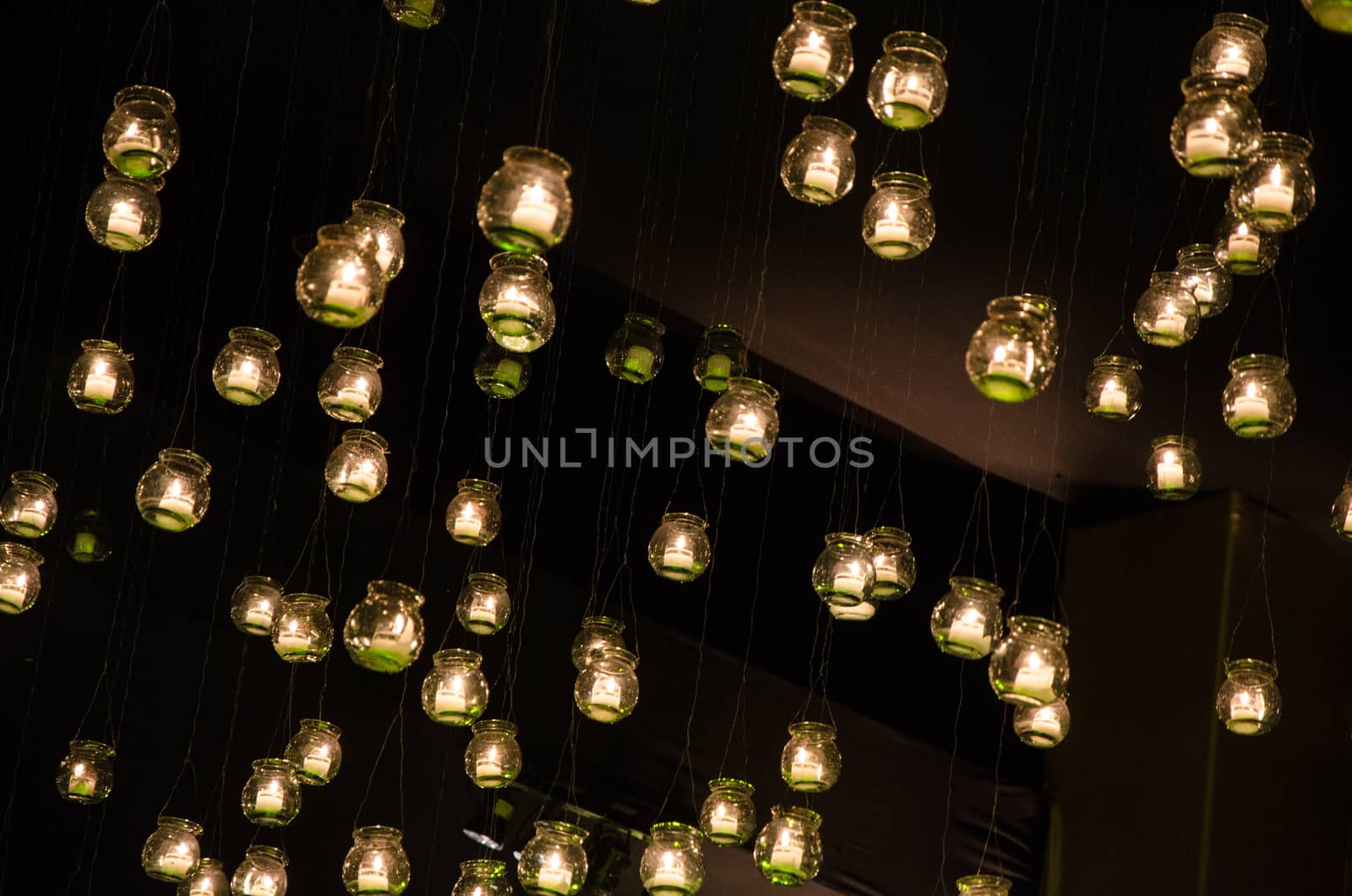 floating candles moored to a tree